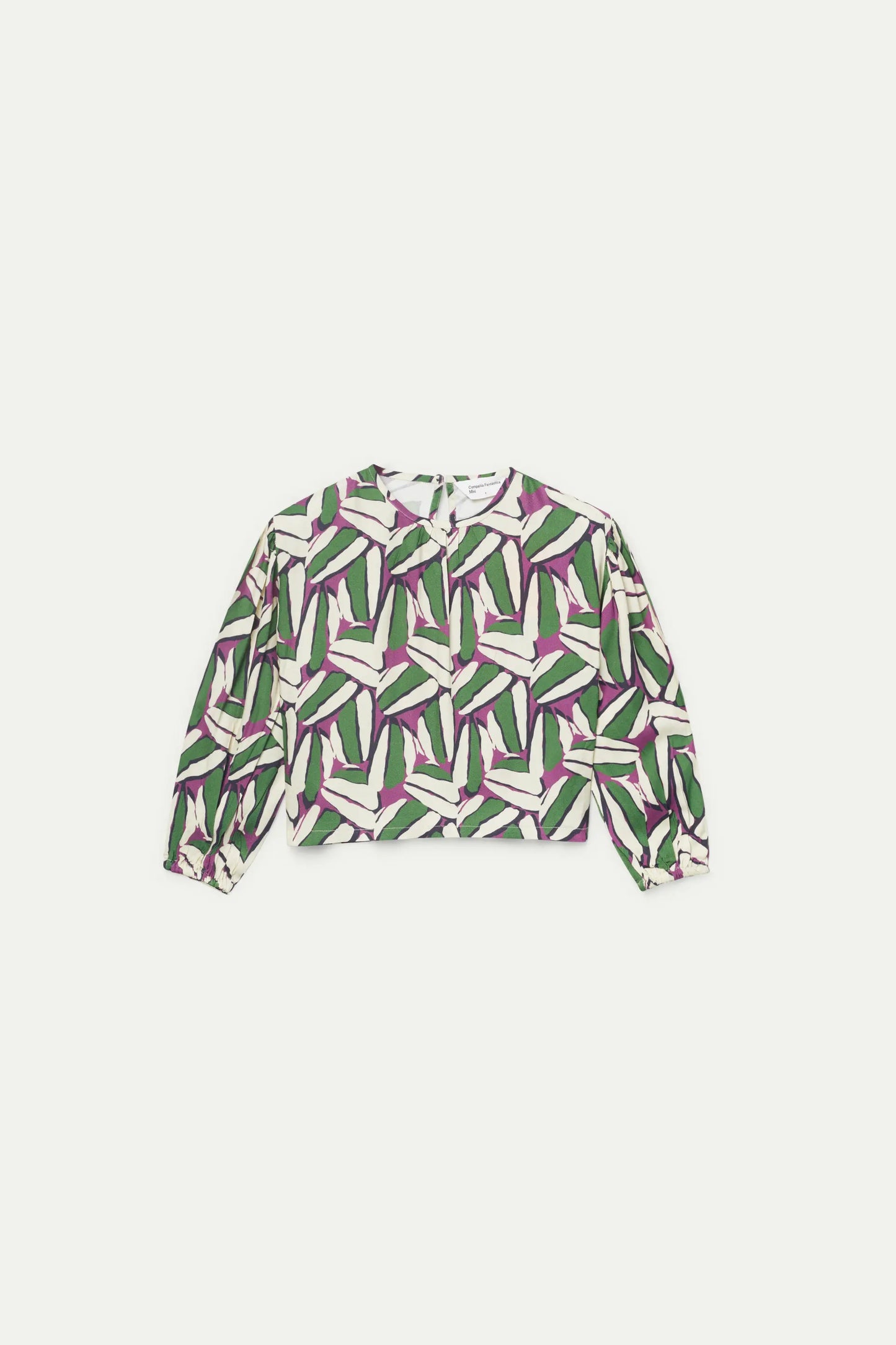 Top da bambina verde con stampa geometrica