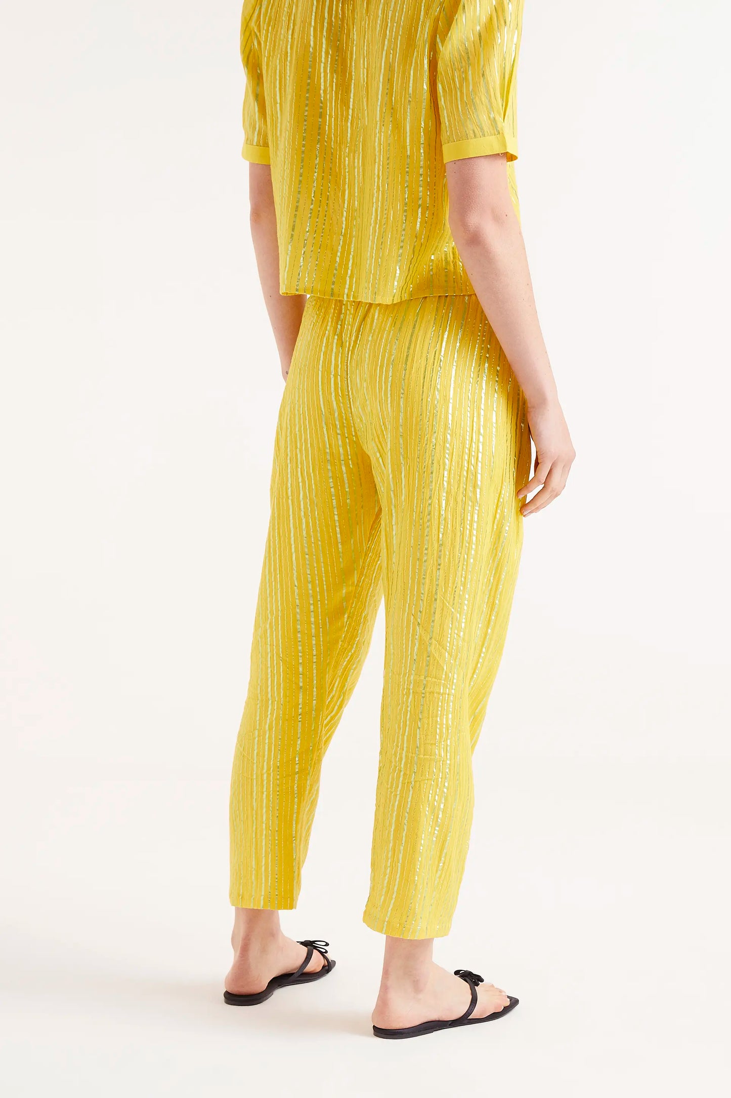 Long yellow lurex trousers