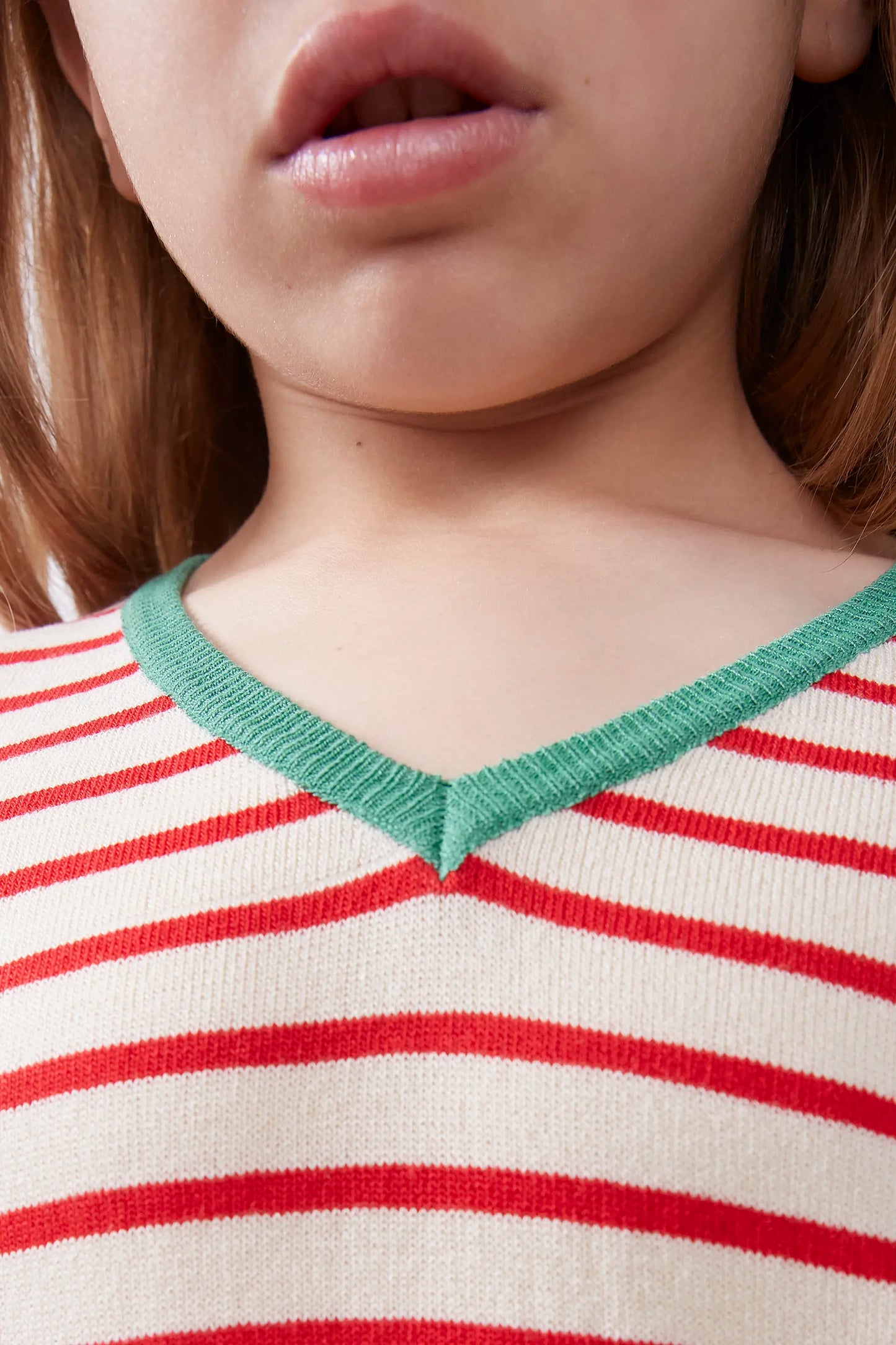 Girl's V-neck sweater with red stripes