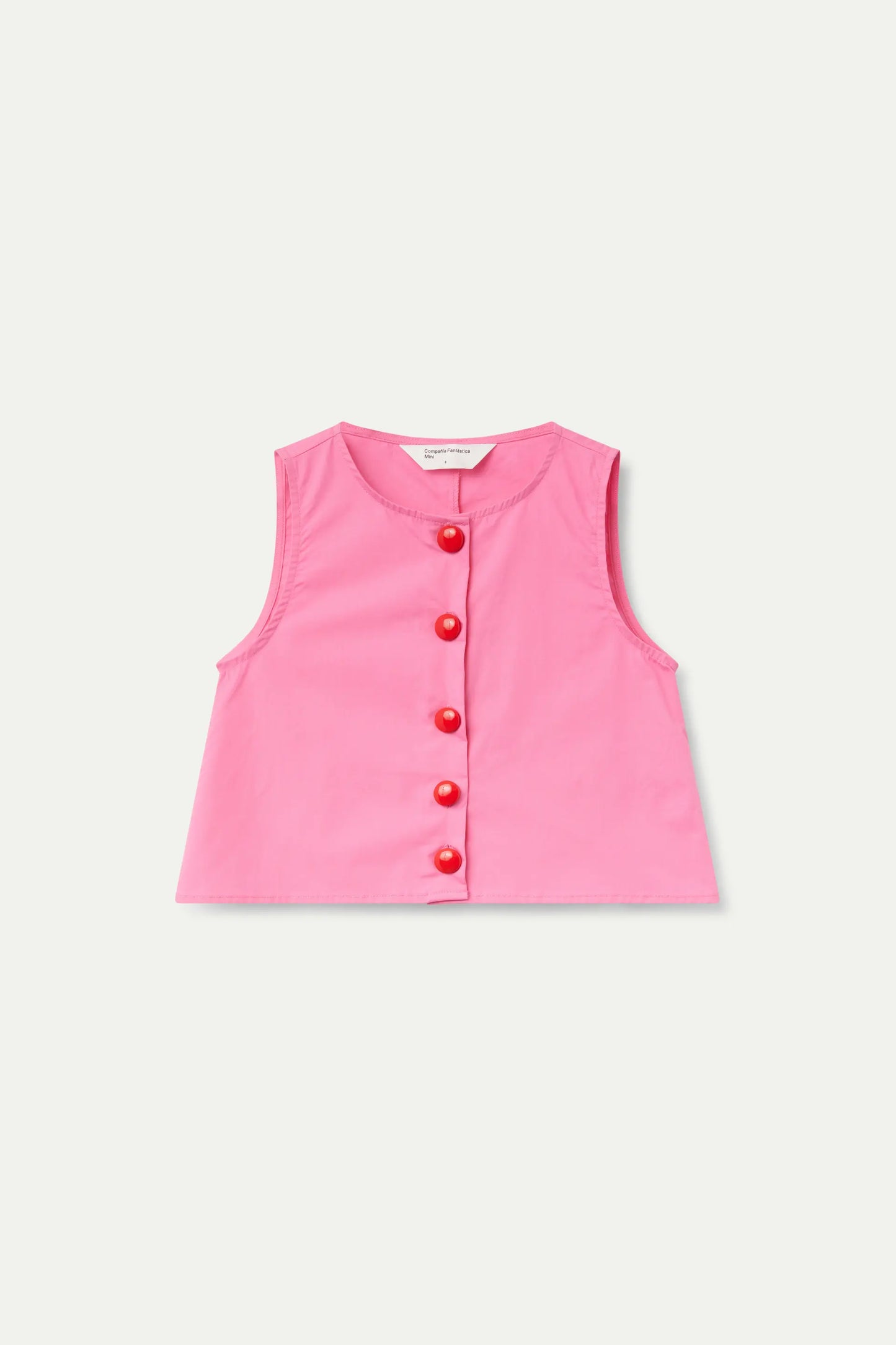 Top rosa con bottoni per bambina