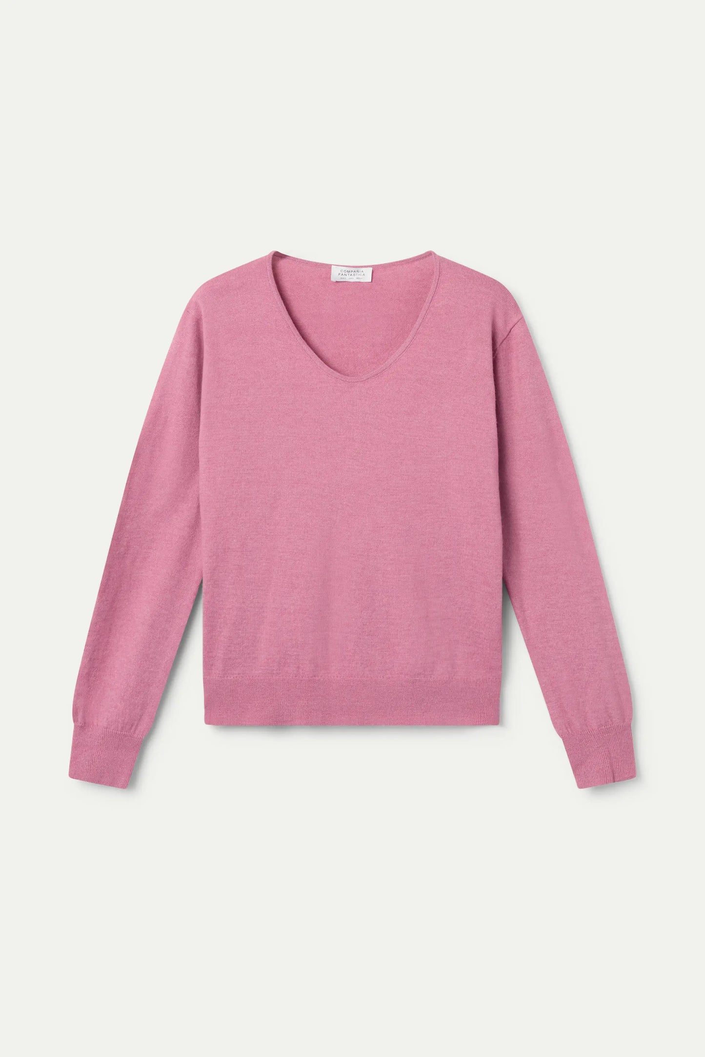 Maglione rosa lavorato a maglia con scollo a V