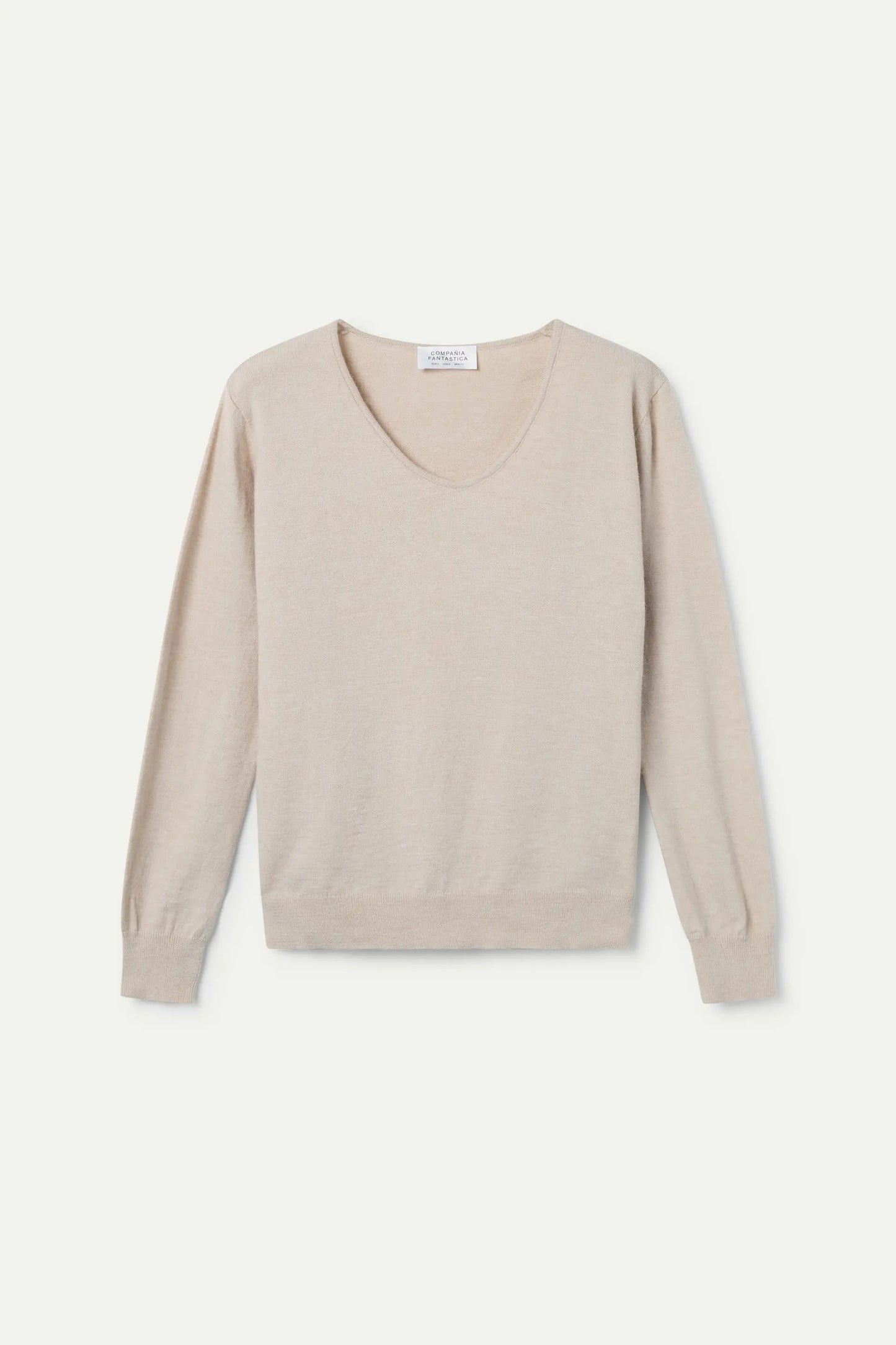 Maglione beige lavorato a maglia con scollo a V
