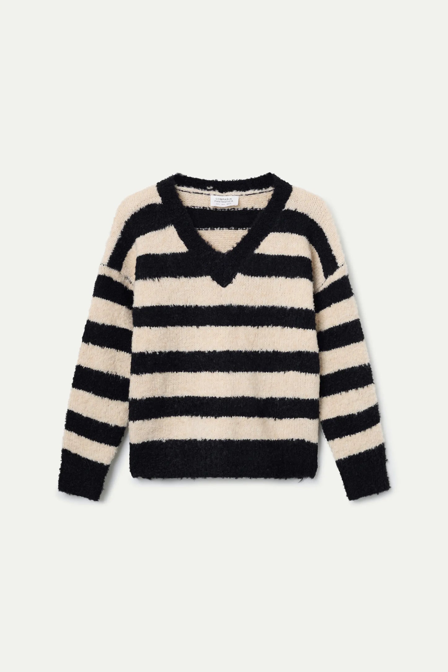 Maglione lavorato a maglia con trama a righe bianche e nere