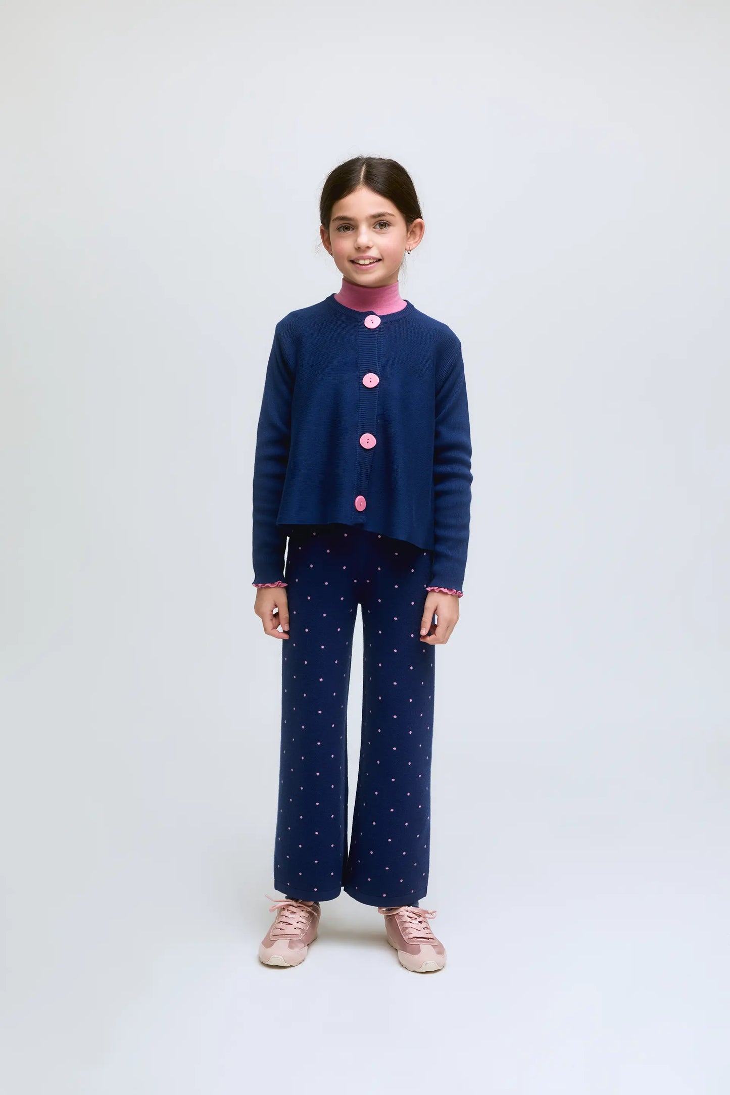 Navy blue fine knit girl's cardigan with contrasting buttons