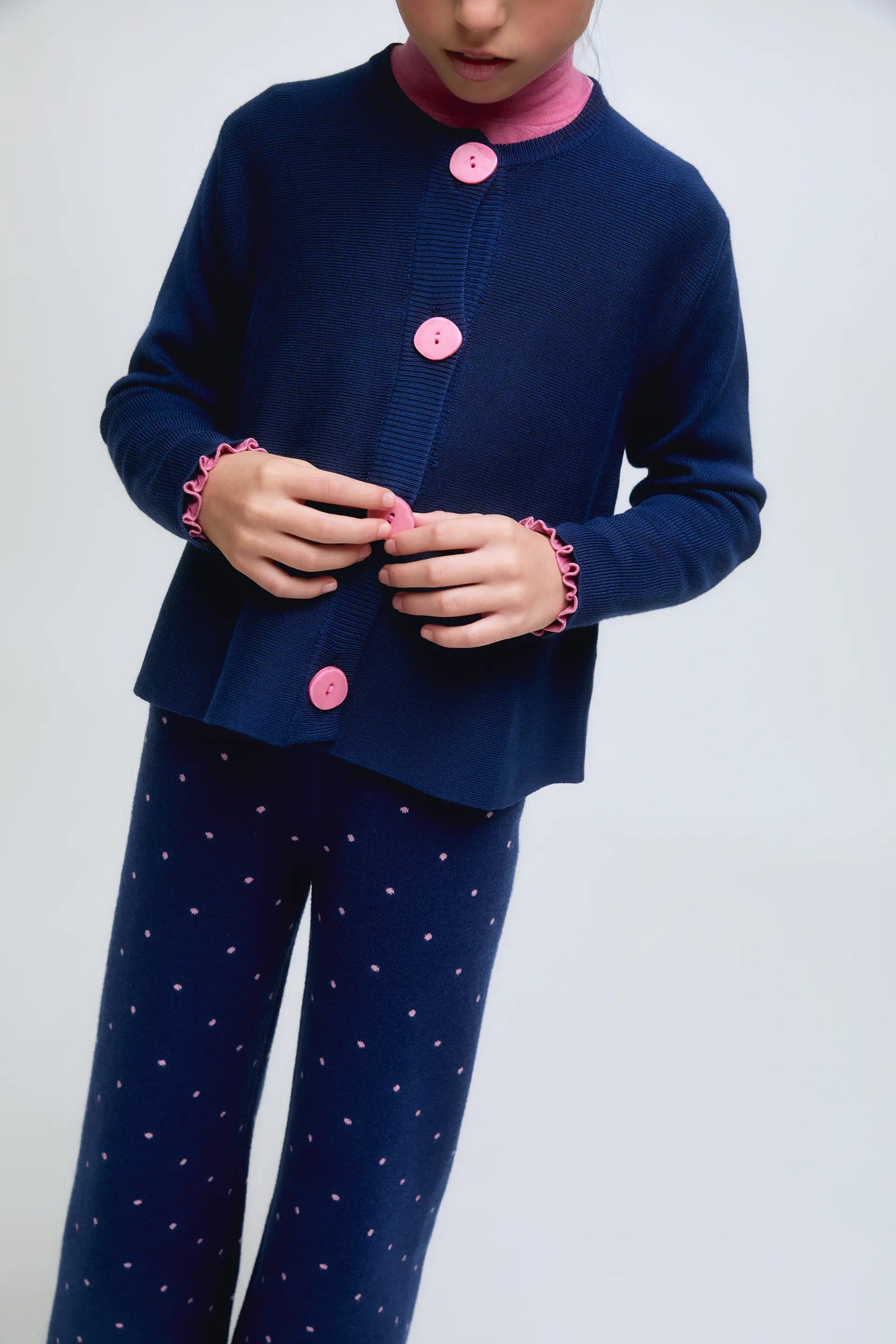 Navy blue fine knit girl's cardigan with contrasting buttons