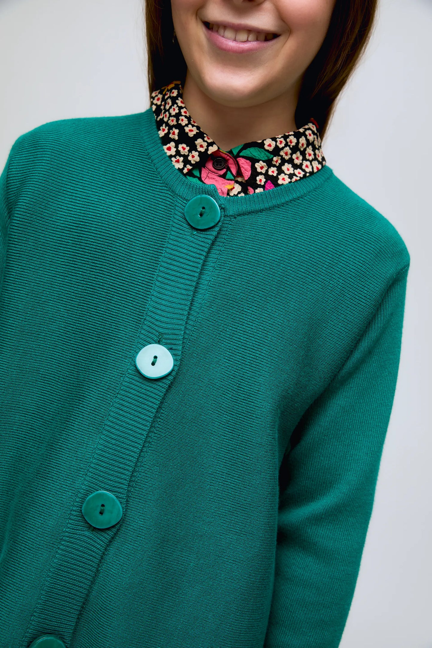 Green fine knit girl's cardigan with large button