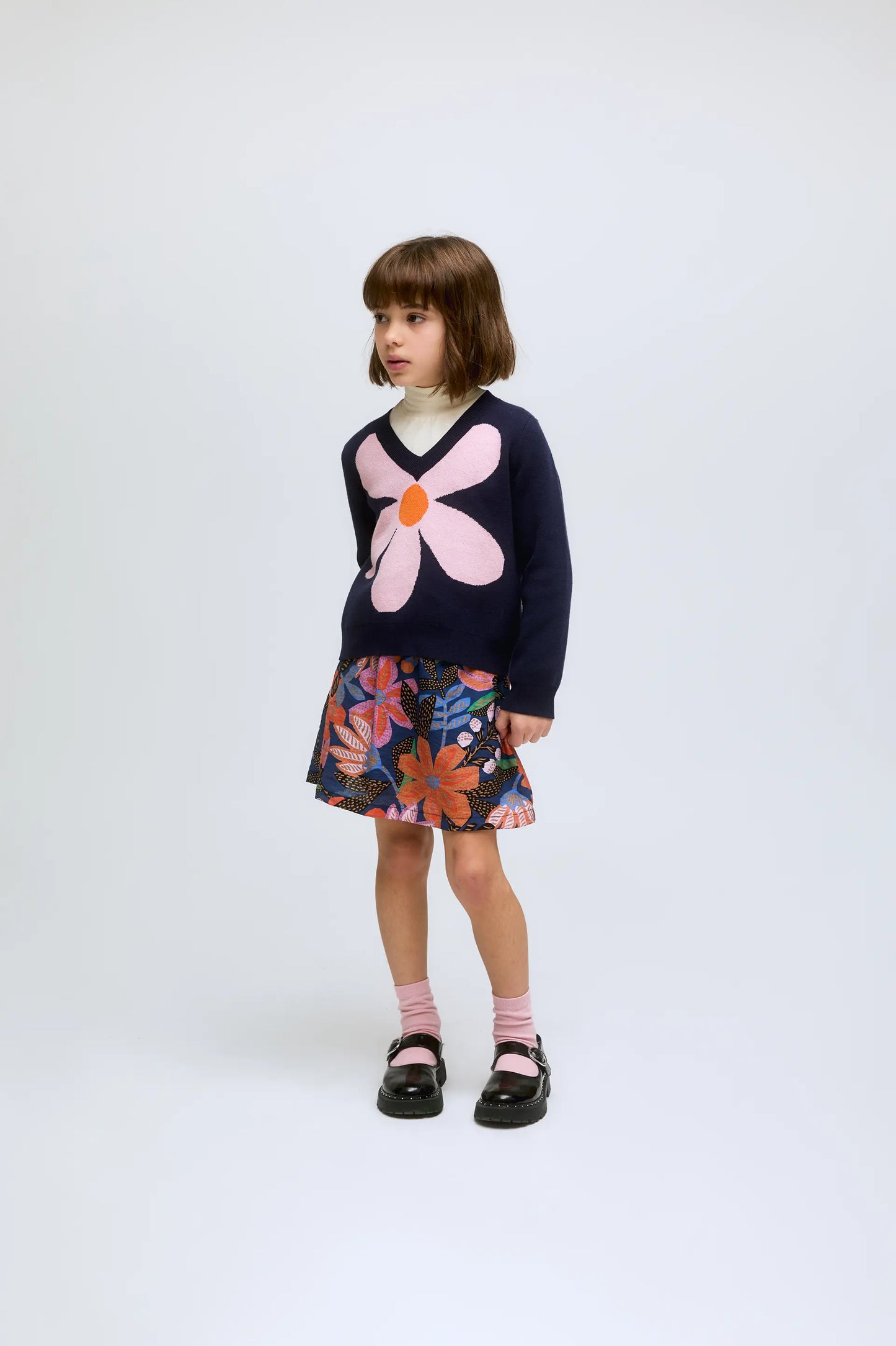 Navy blue knitted girl's sweater with flower print