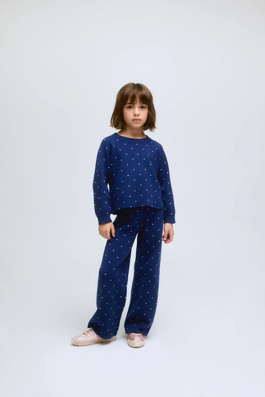 Pantalón de niña de punto azul marino con lunares rosas