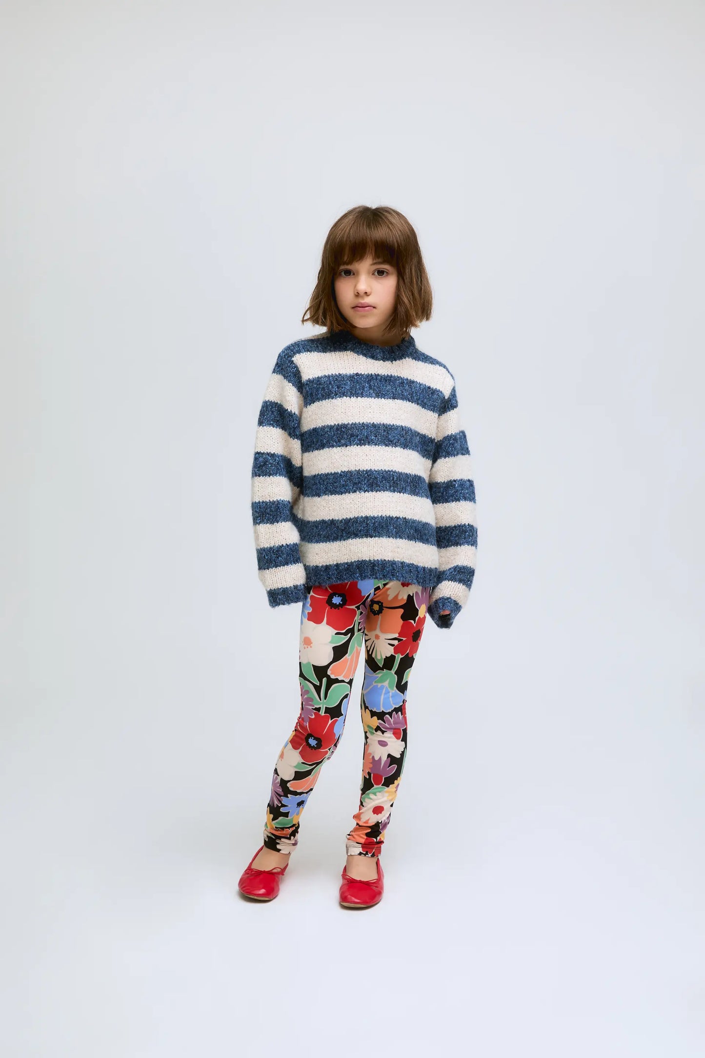 White and blue striped knitted girl's sweater