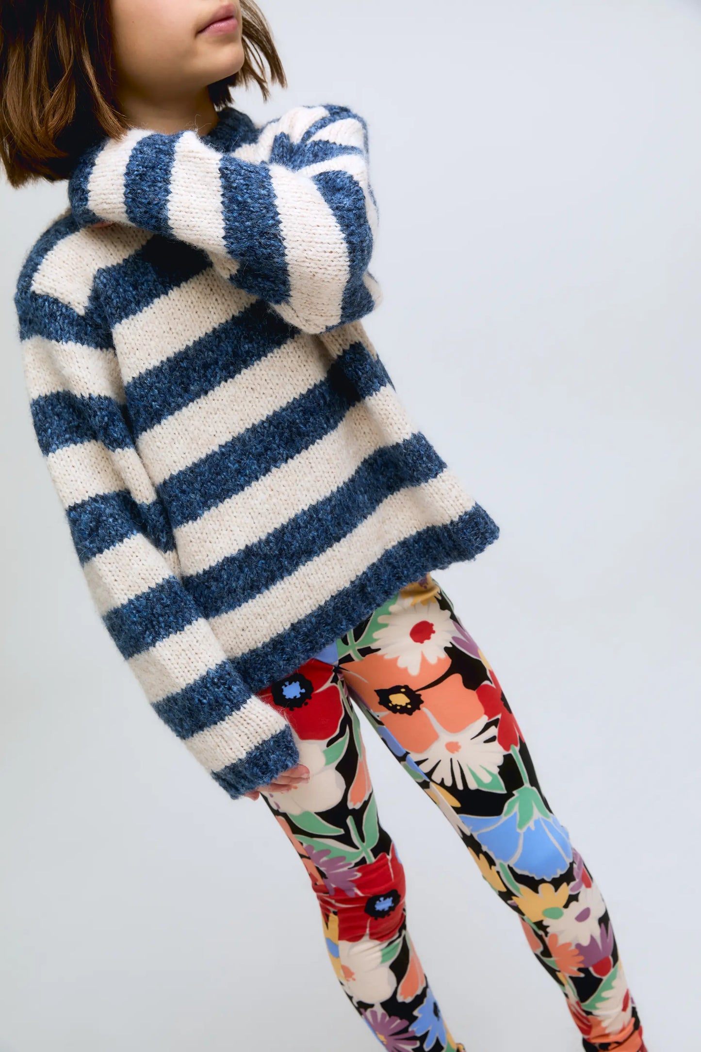 White and blue striped knitted girl's sweater