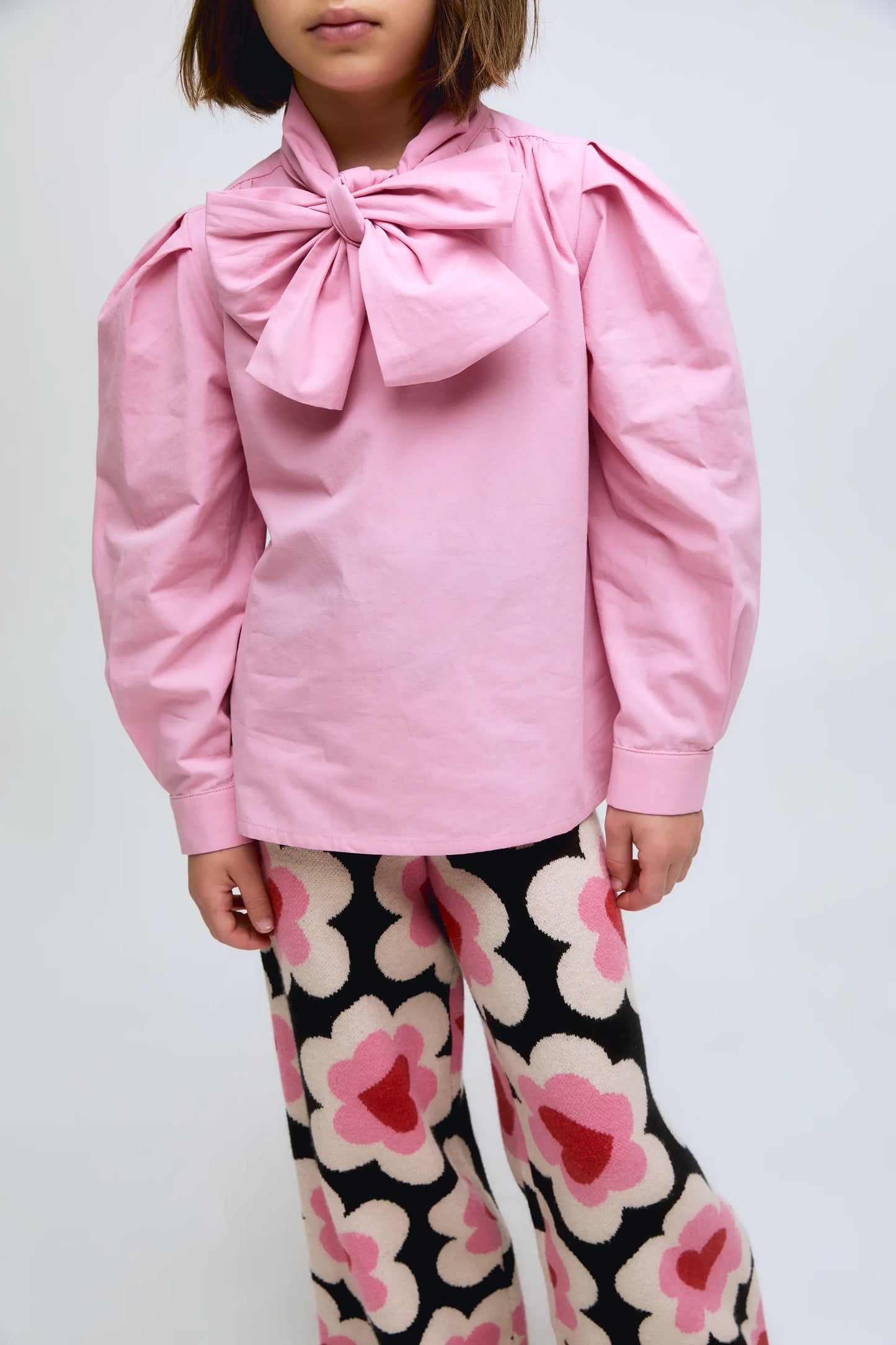Pink cotton shirt with bow at the neck