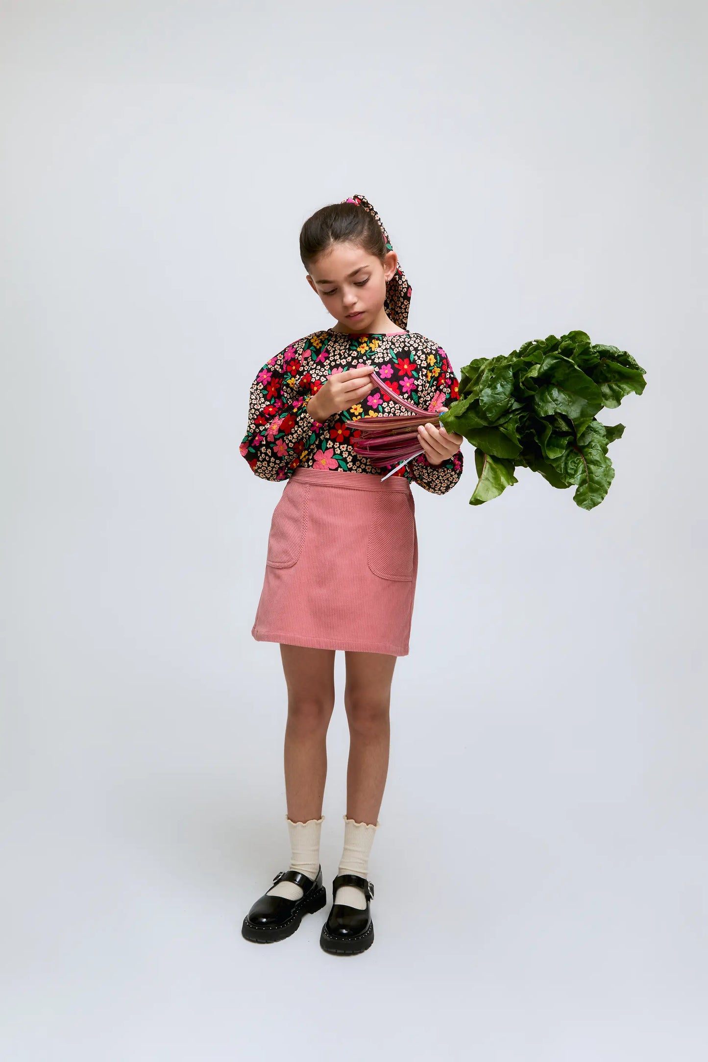 Short pink corduroy skirt with front pockets