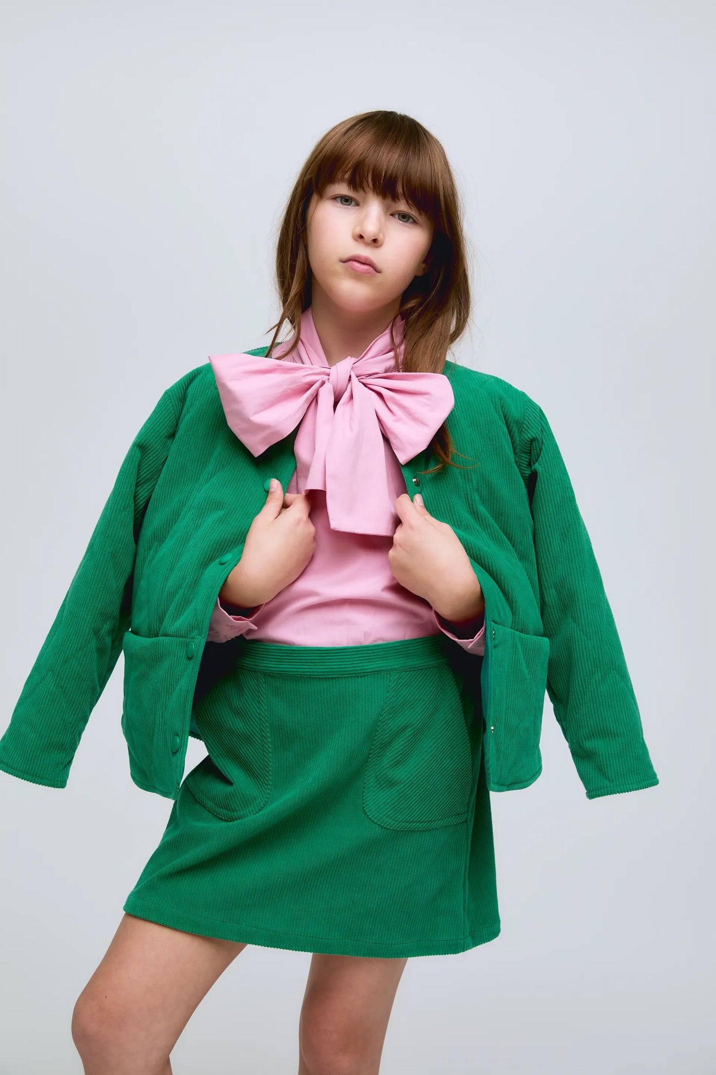 Short green corduroy skirt with front pockets