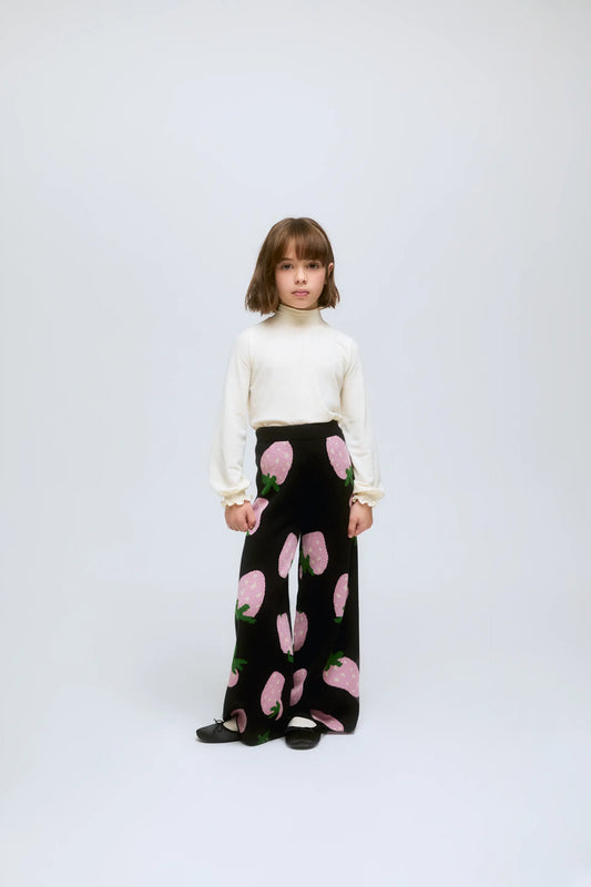 Jersey de niña blanco de cuello alto y puños fruncidos