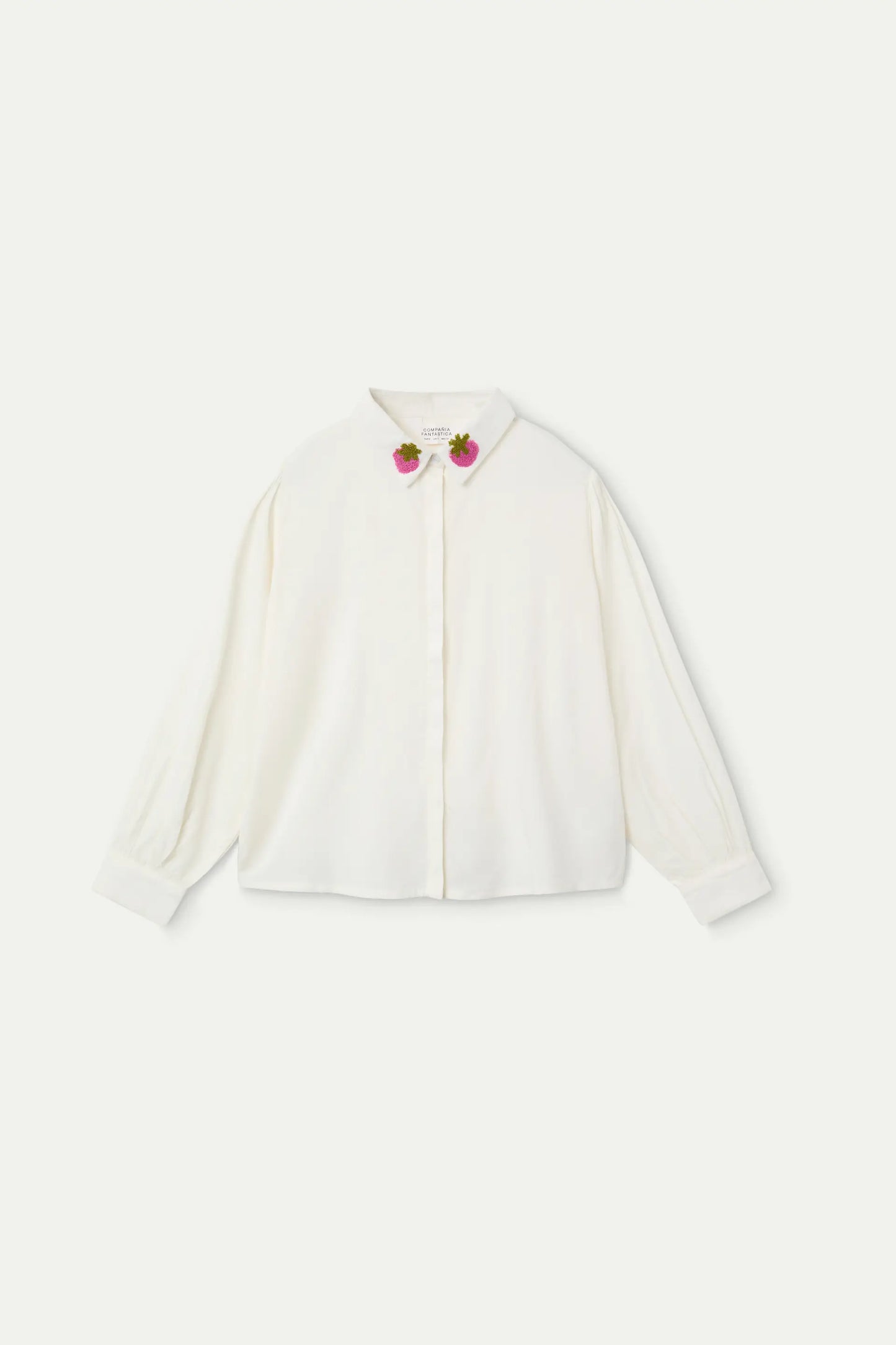 Girl's white shirt with strawberry embroidered collar.