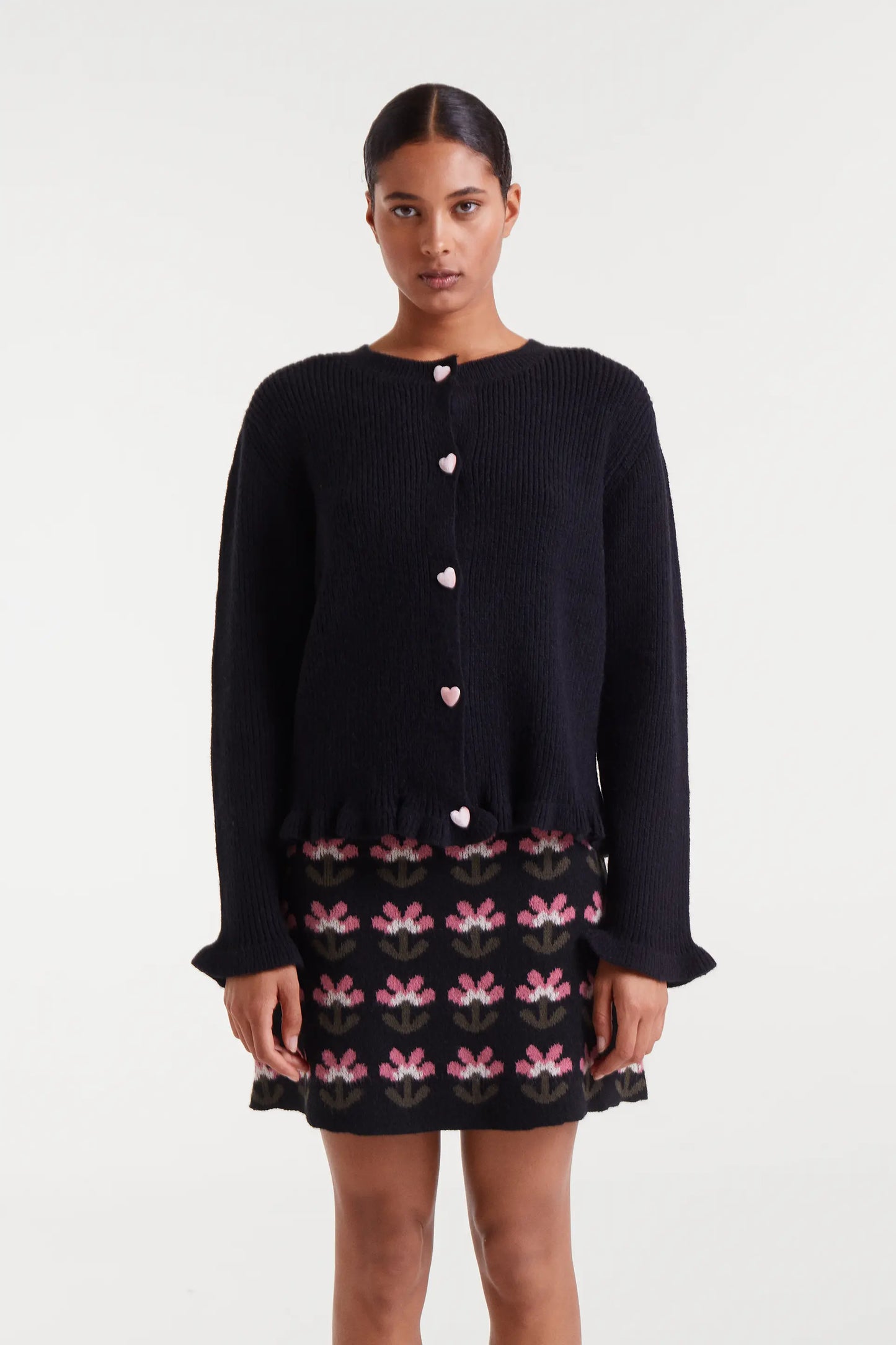 Black knit cardigan with heart detail