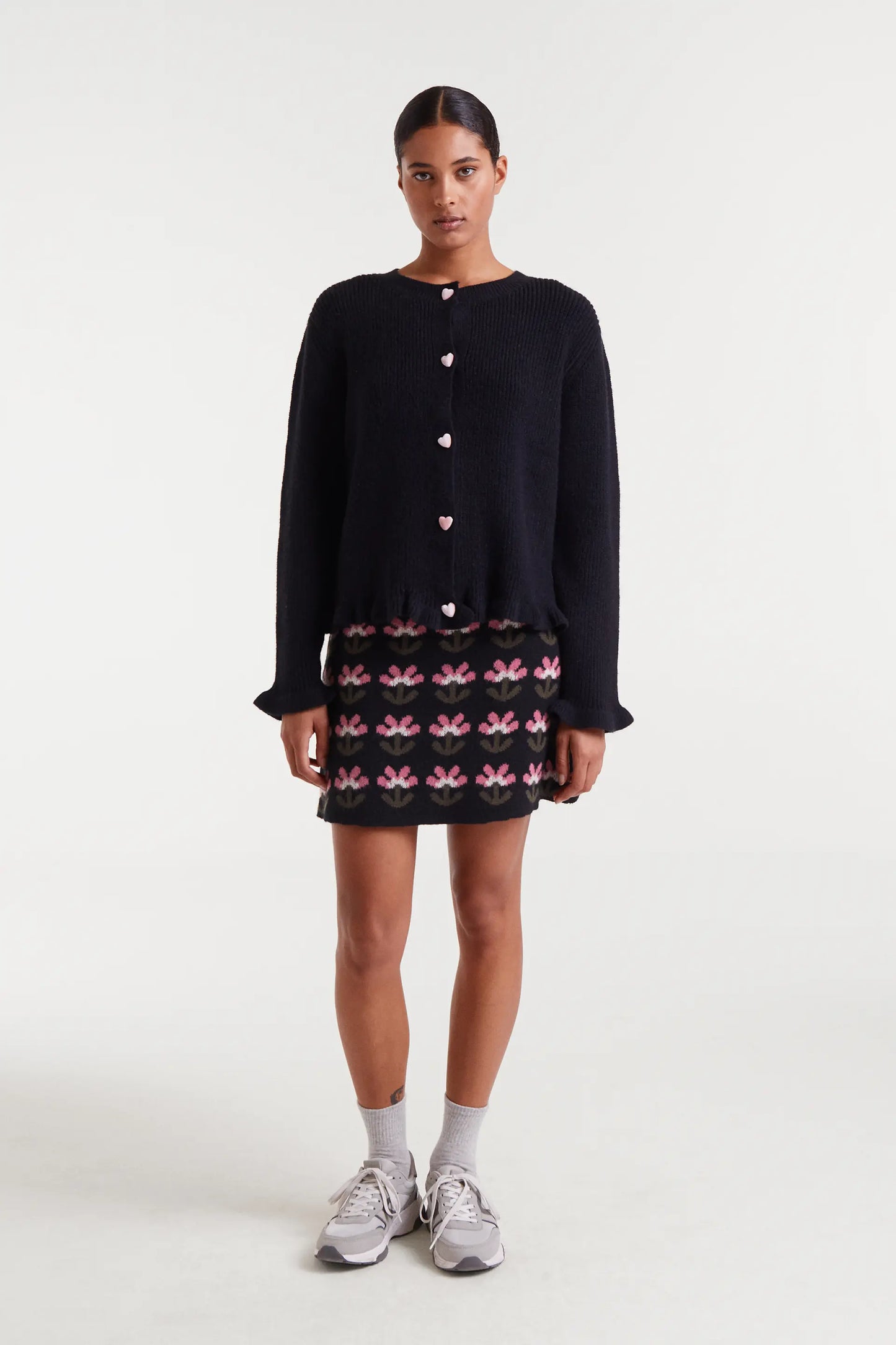 Black knit cardigan with heart detail