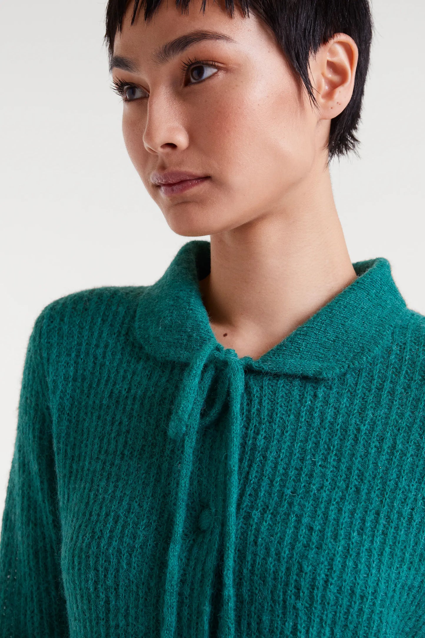 Cardigan in maglia con fiocco turchese