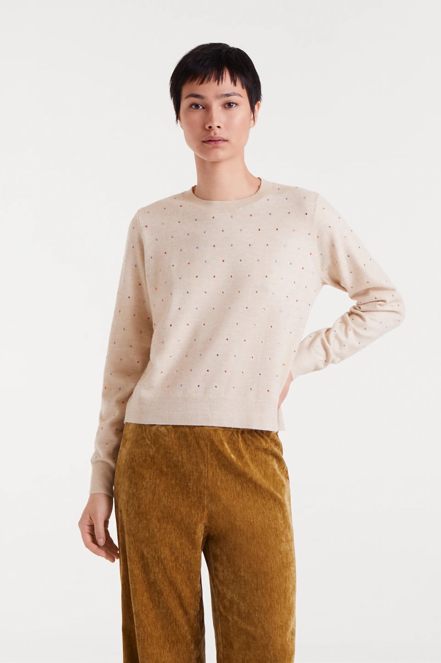 Beige fine knit sweater with multi-colored details