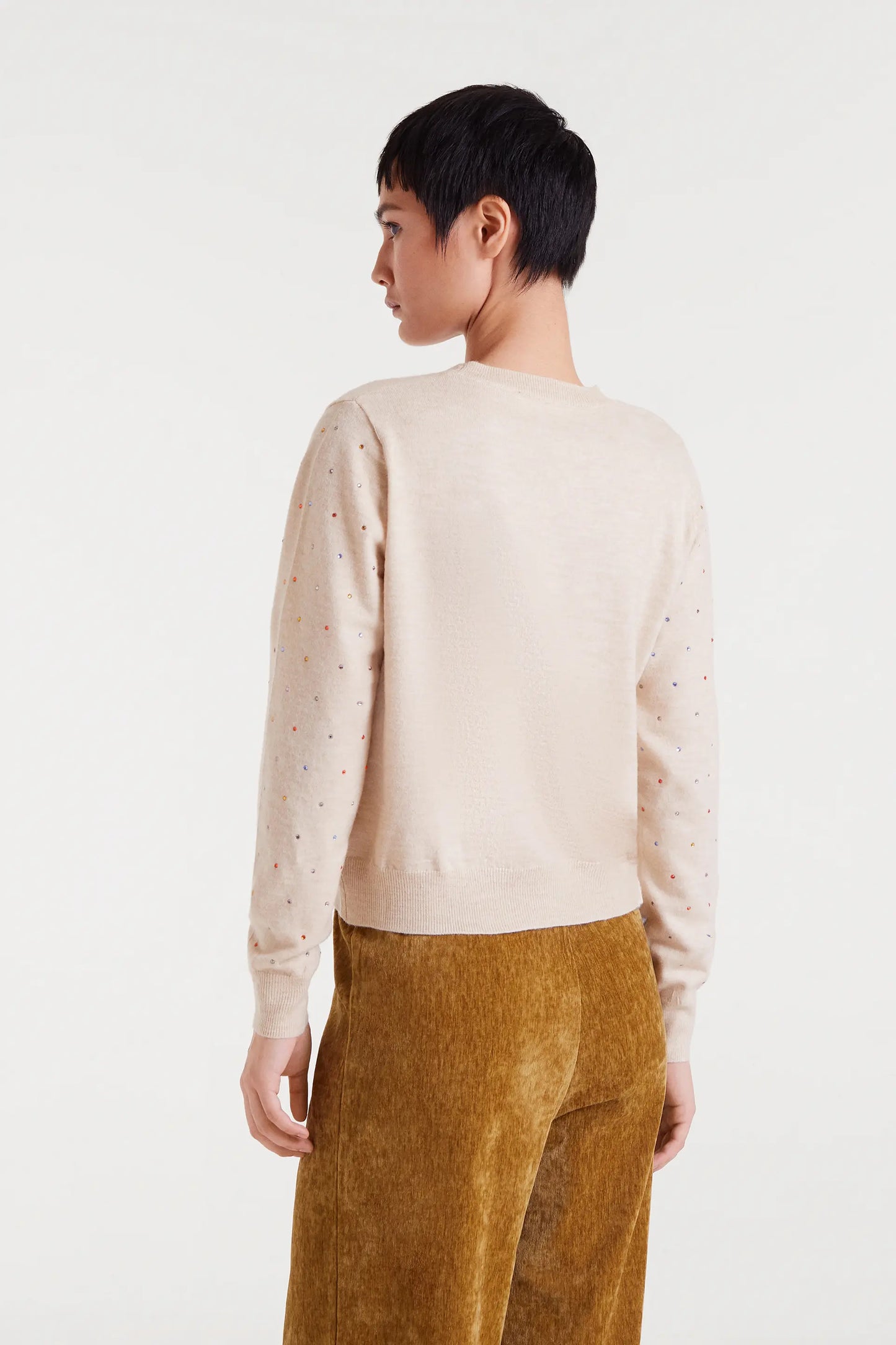 Beige fine knit sweater with multi-colored details