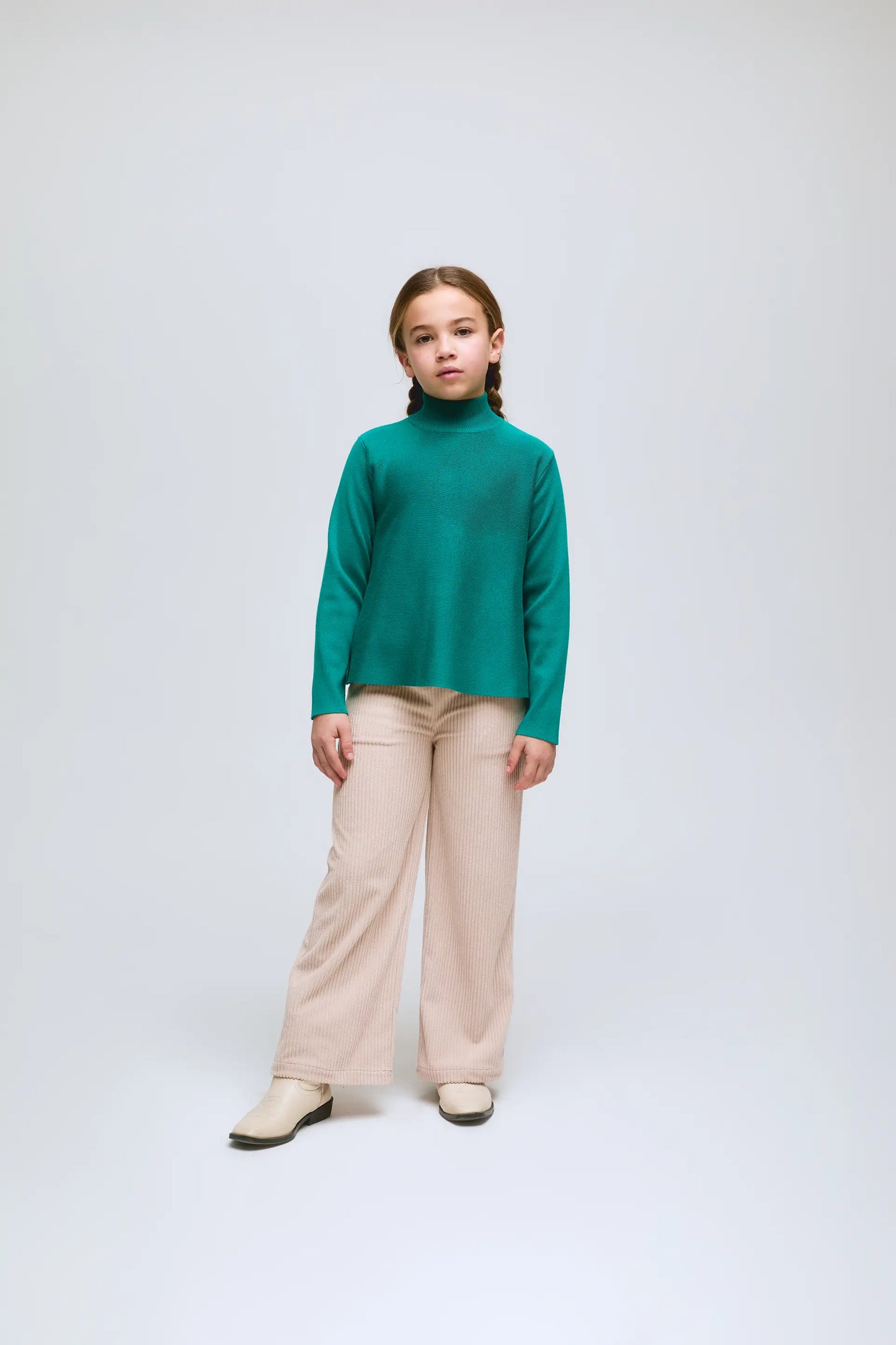 Girl's green long-sleeved turtleneck sweater