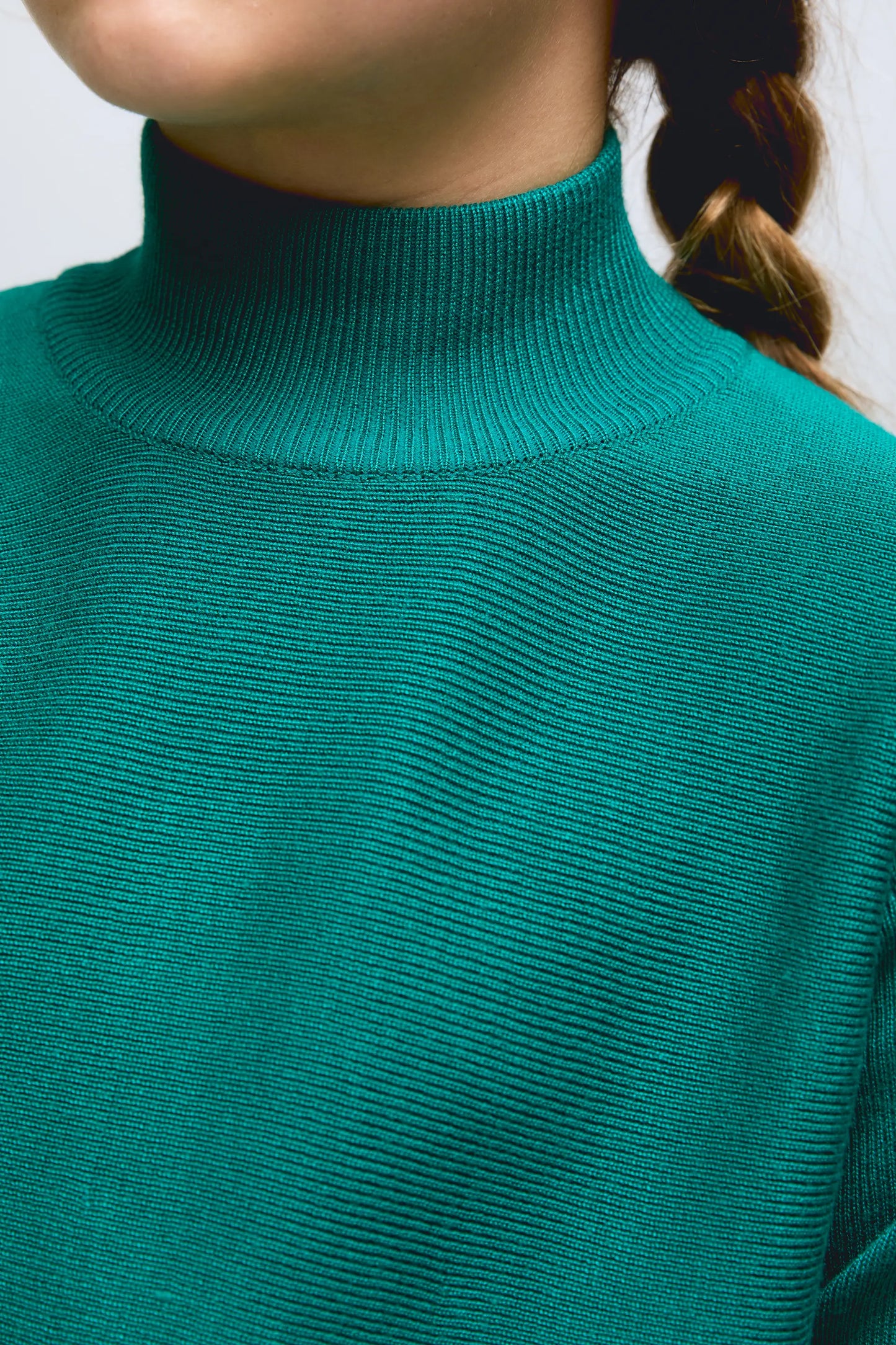Girl's green long-sleeved turtleneck sweater