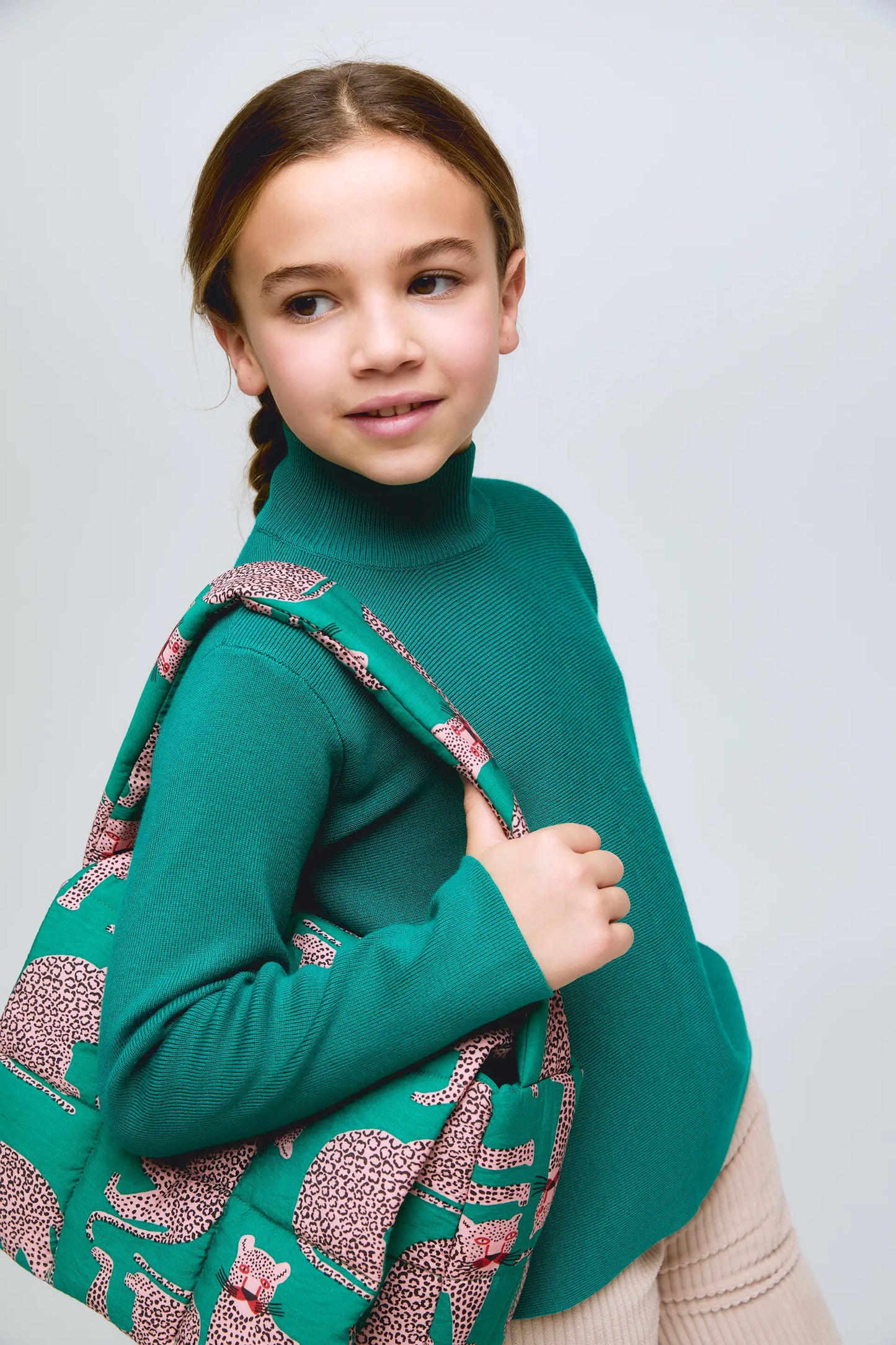 Girl's green long-sleeved turtleneck sweater