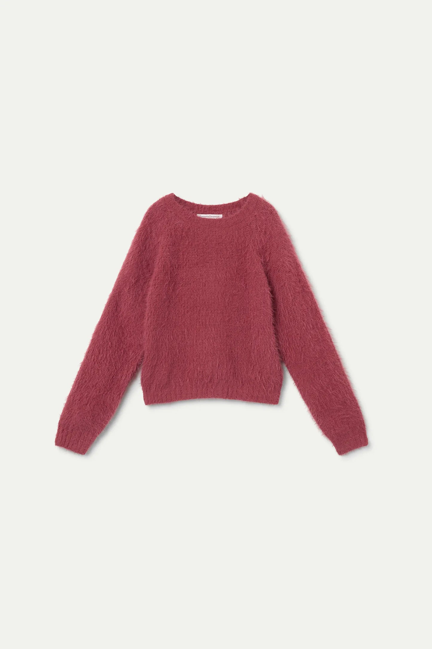 Maglione rosa da bambina con finitura screziata.