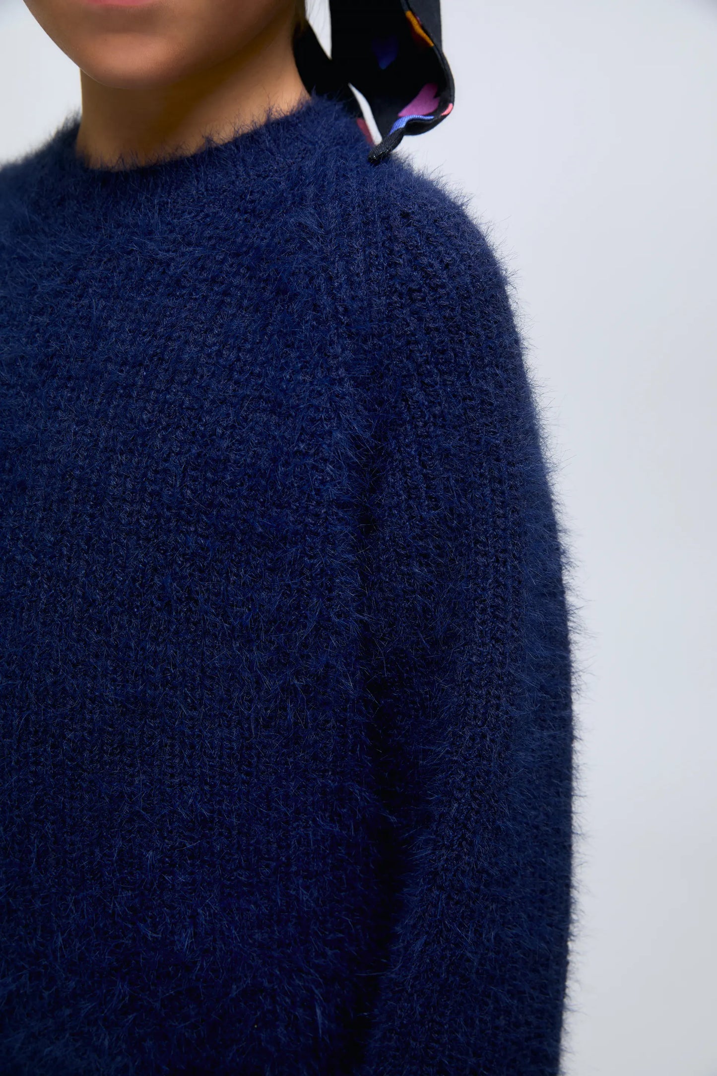 Blue knitted girl's sweater.