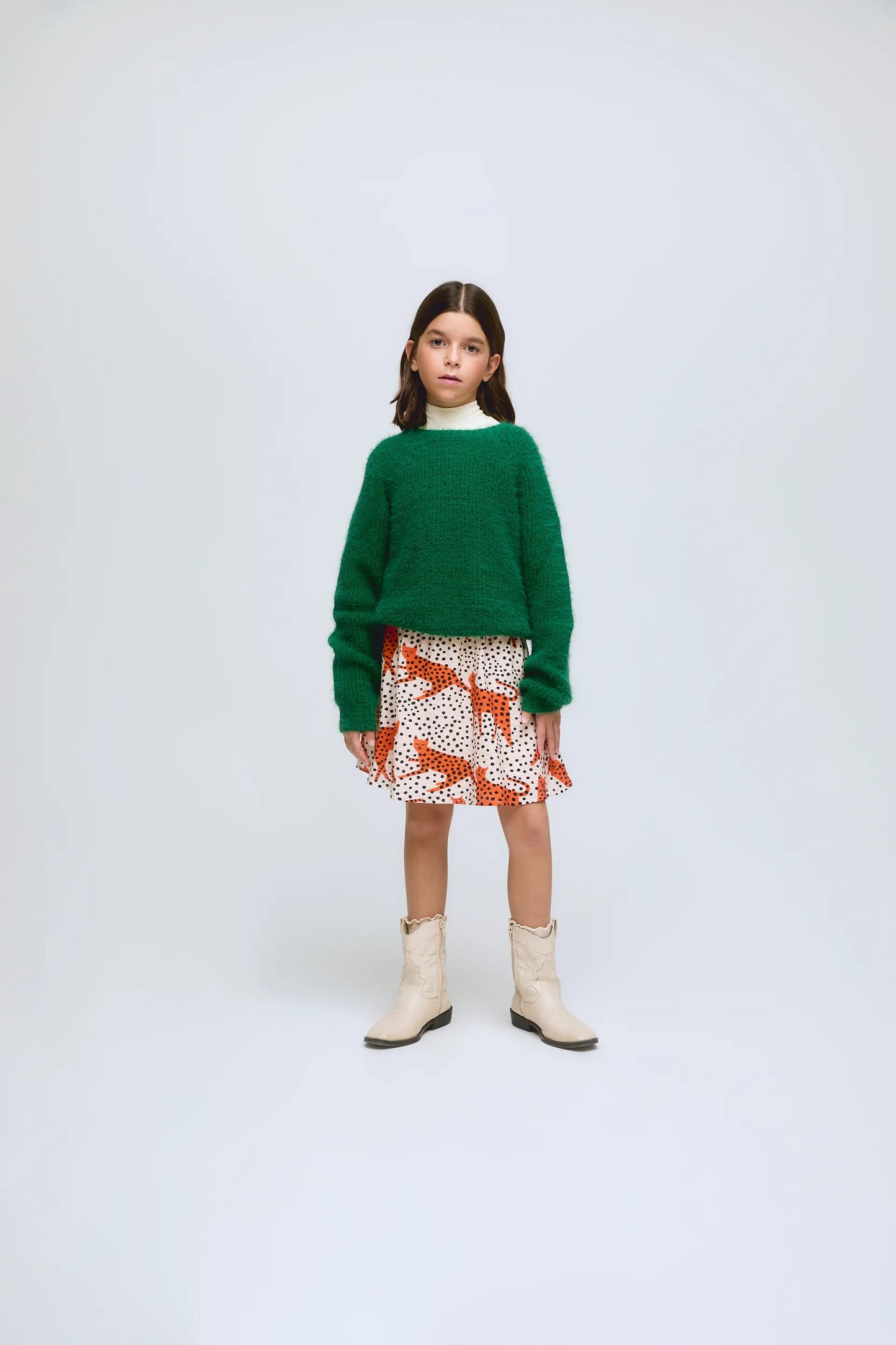 Green knitted girl's sweater.