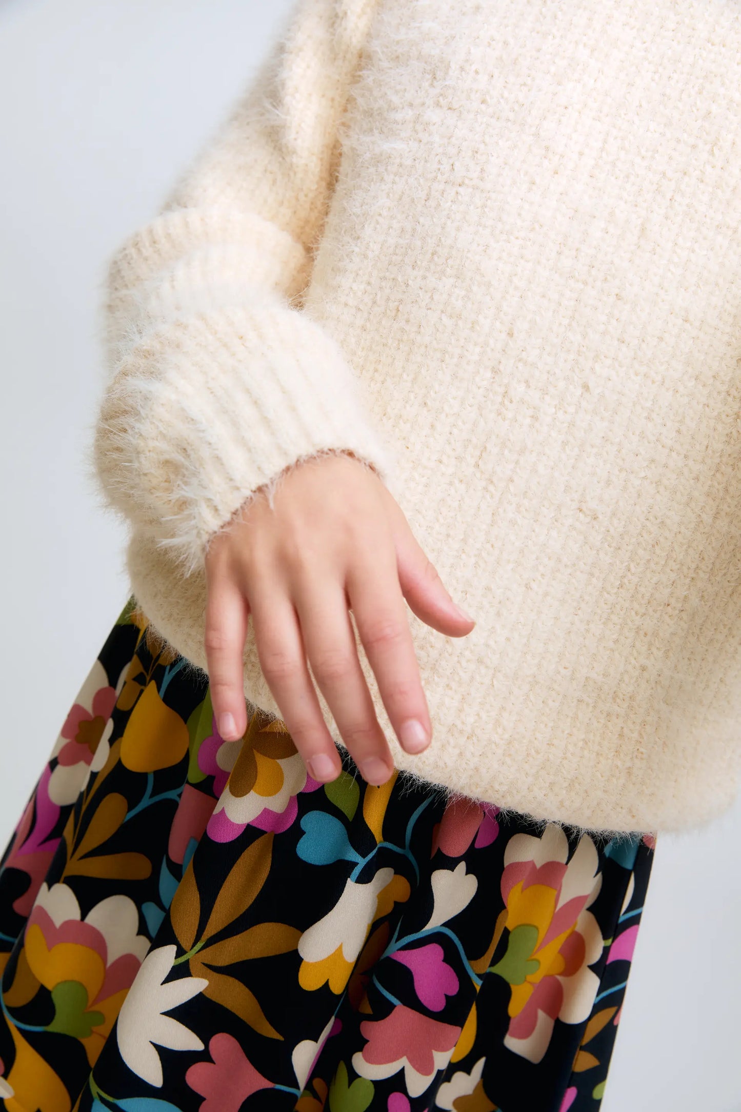 White knitted girl's sweater