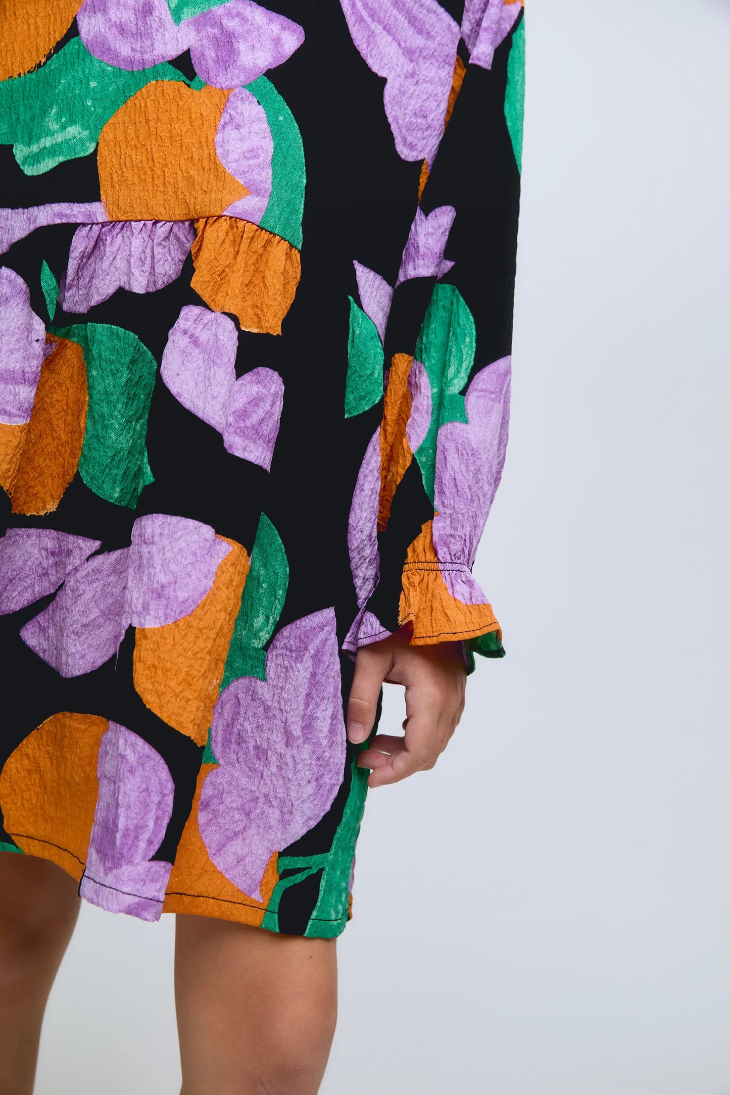 Short long-sleeved girl's dress with apricot print