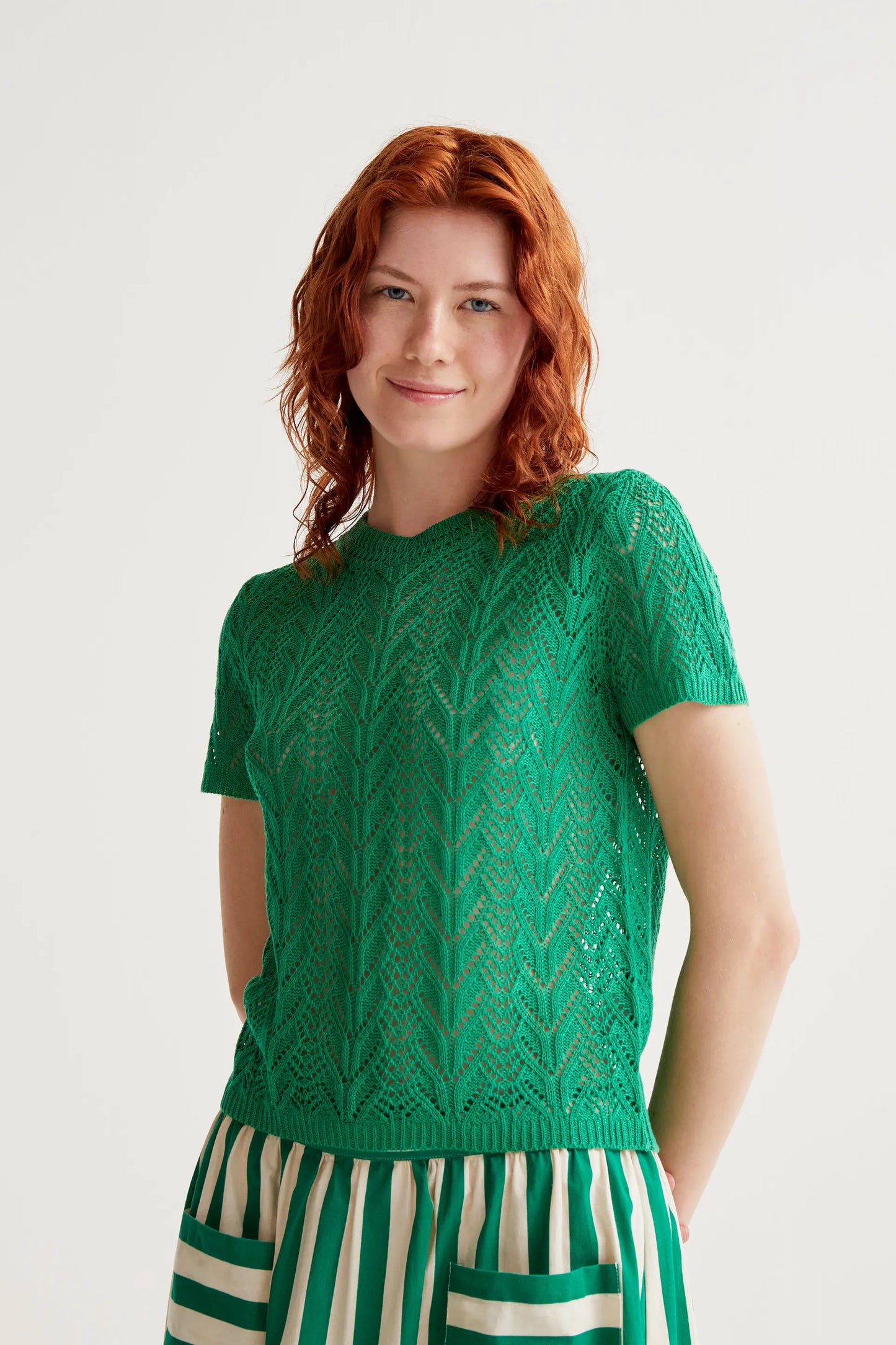 Openwork embroidered top in the shape of a green flower