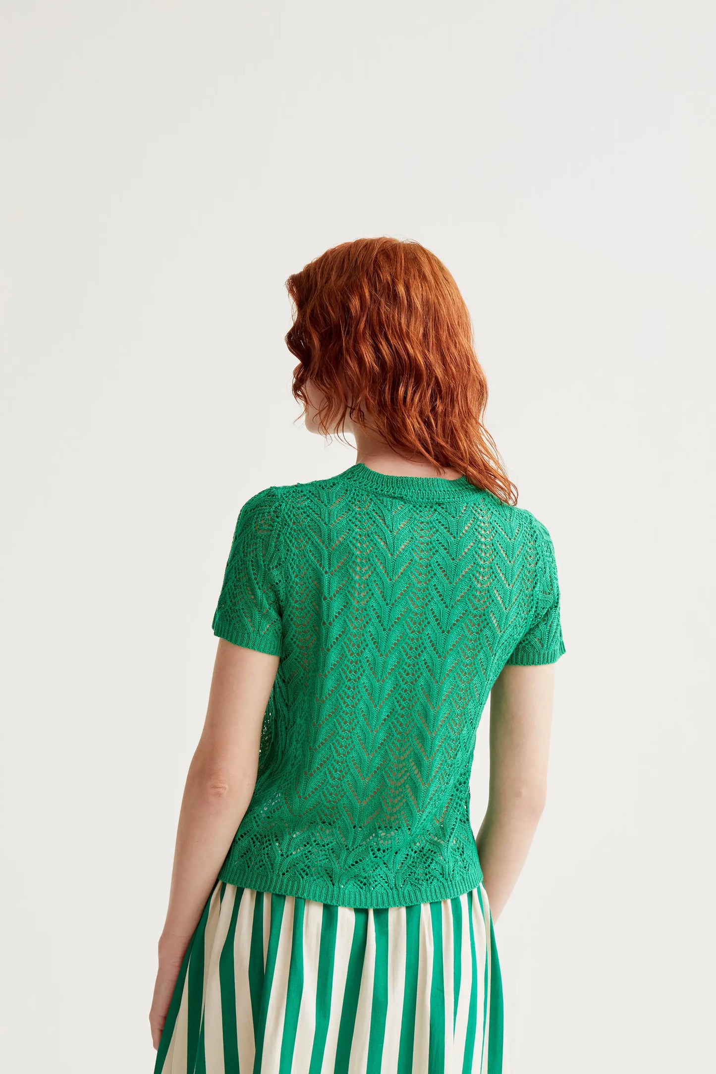 Openwork embroidered top in the shape of a green flower