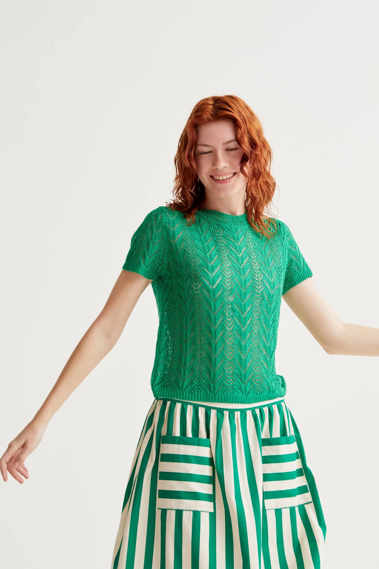 Openwork embroidered top in the shape of a green flower