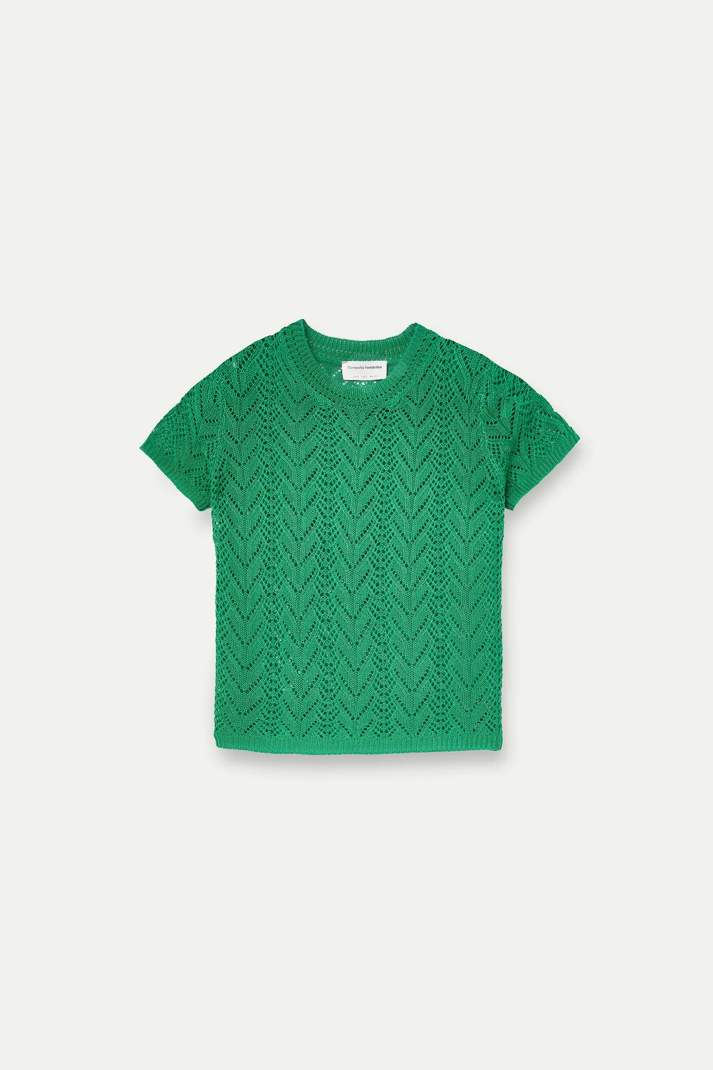 Openwork embroidered top in the shape of a green flower