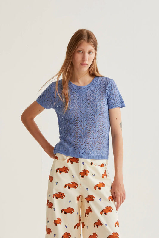 Light blue openwork embroidered top in the shape of a flower