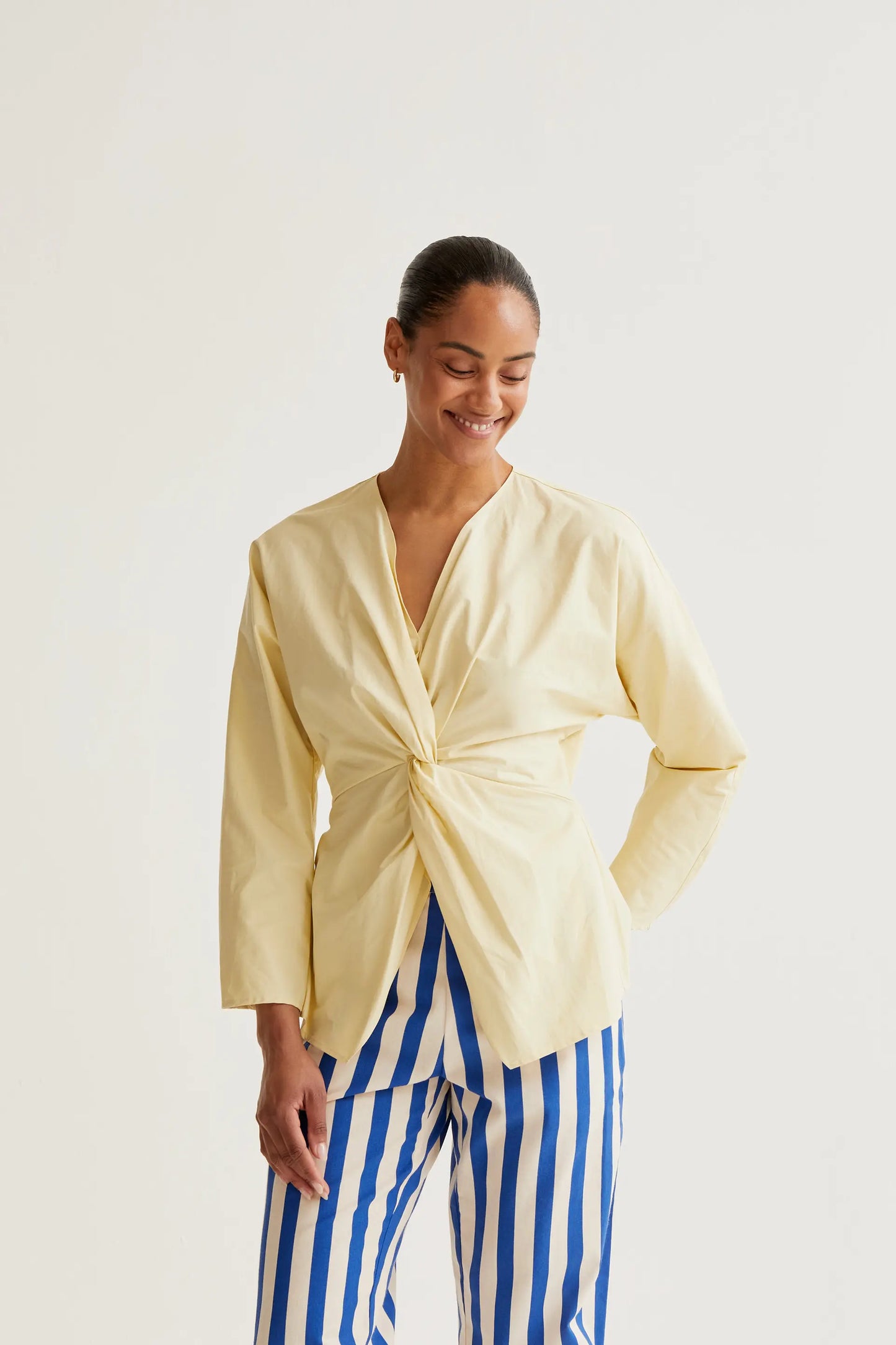Light yellow draped top