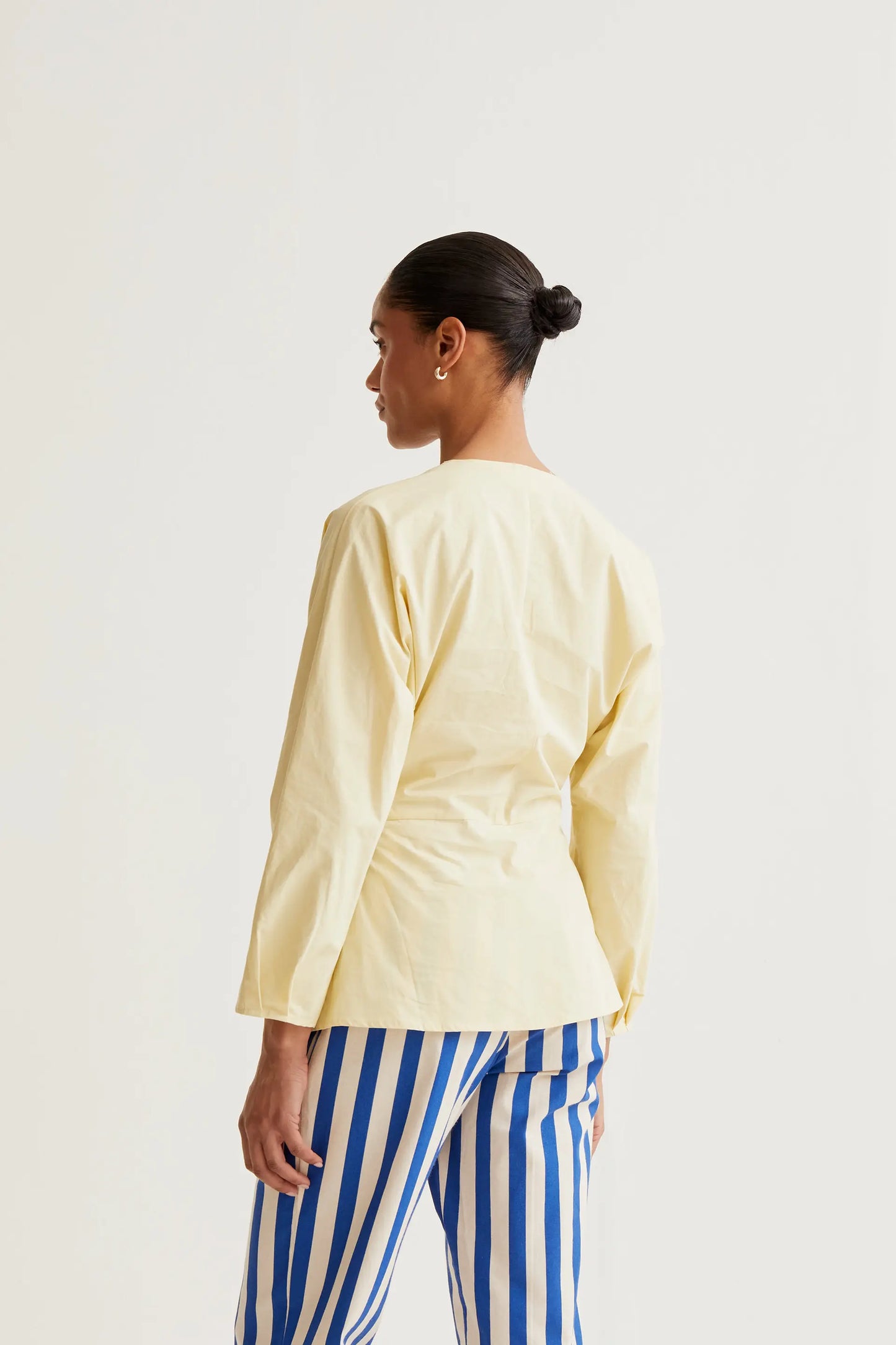 Light yellow draped top