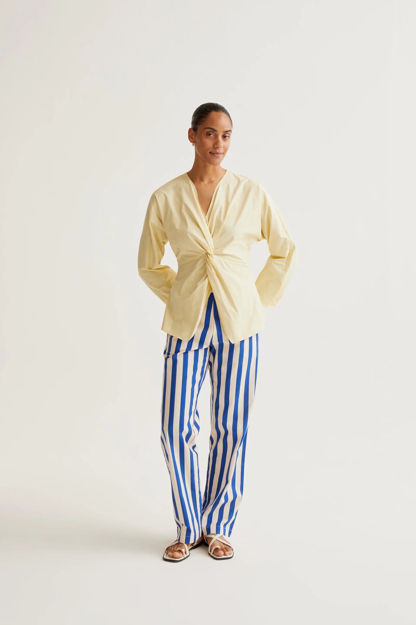 Light yellow draped top