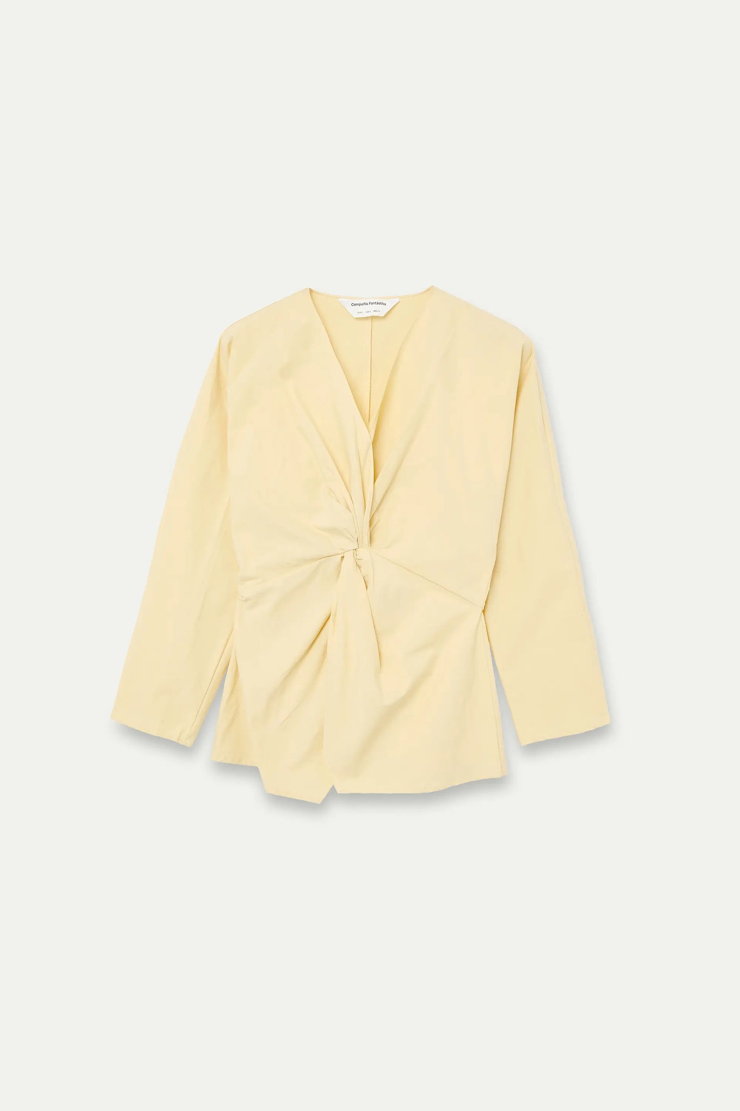 Light yellow draped top