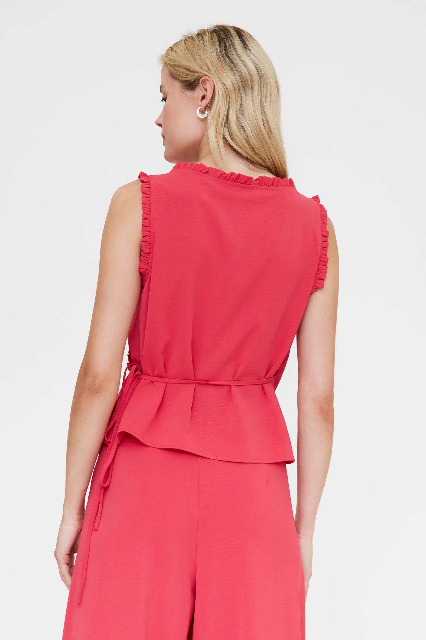 Top fucsia con scollo a V