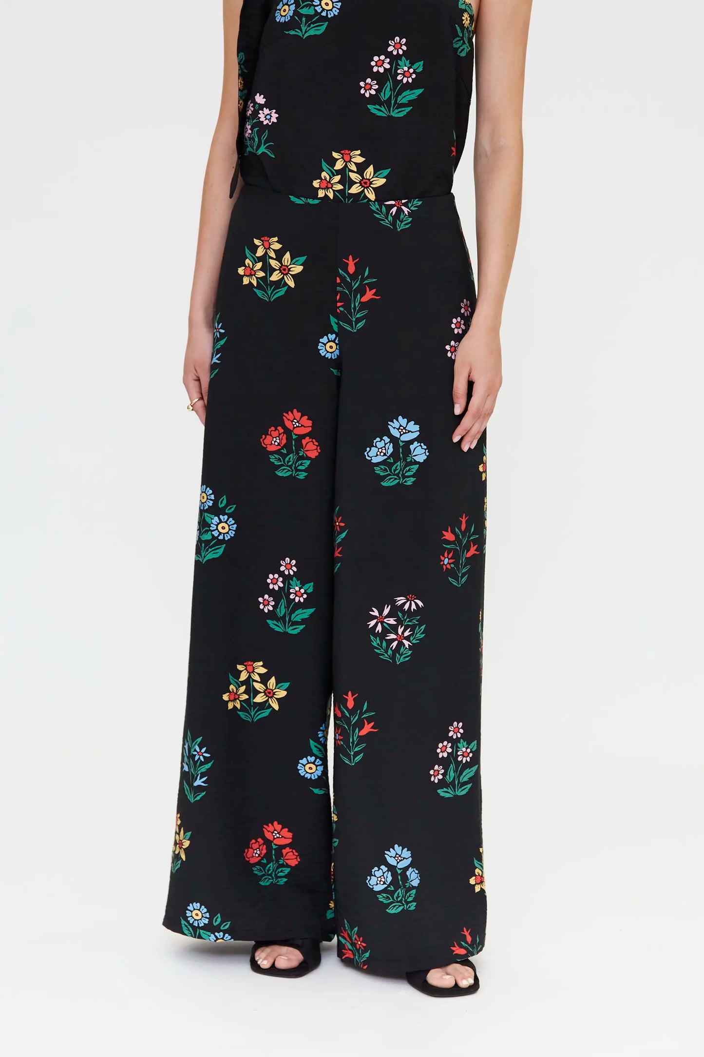 Pantaloni con stampa giardiniere multicolore