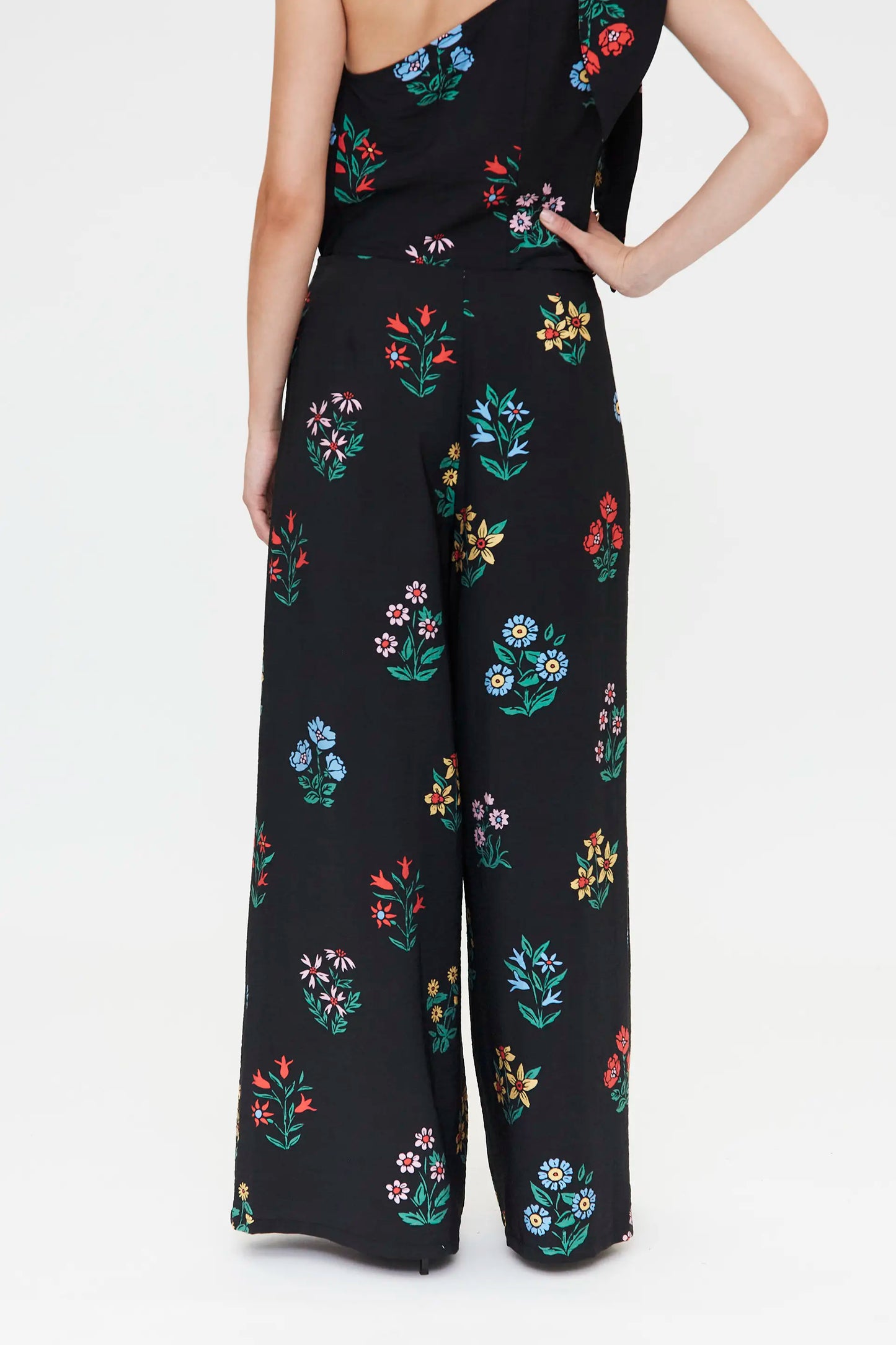 Pantaloni con stampa giardiniere multicolore