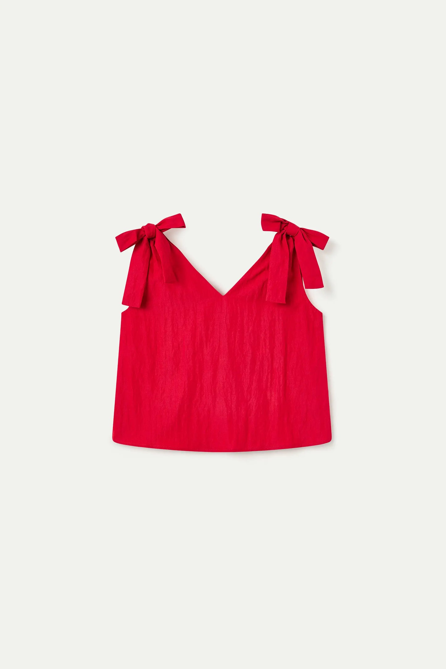 Top rosso asimmetrico con scollo a V