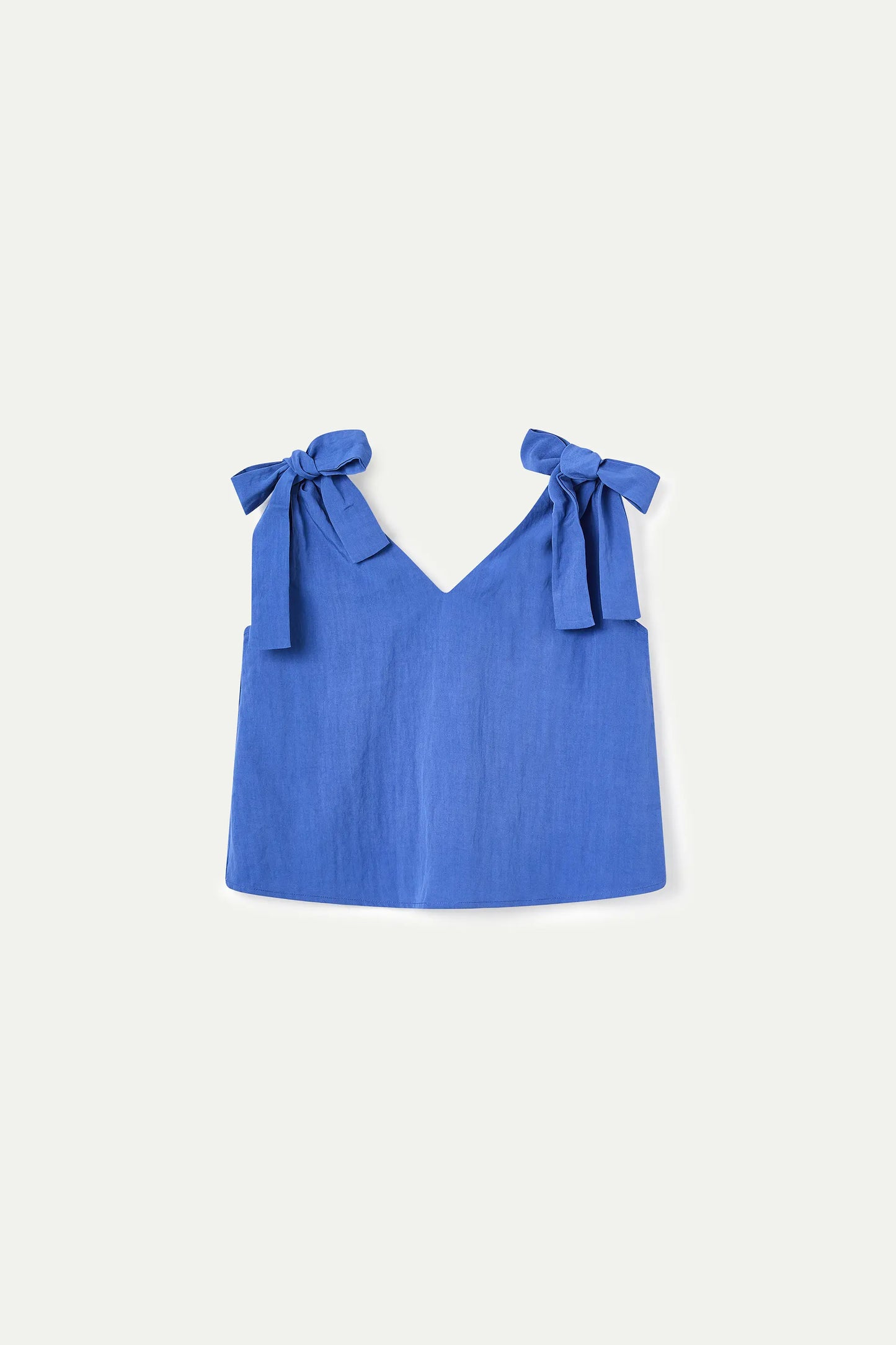 Top blu asimmetrico con scollo a V