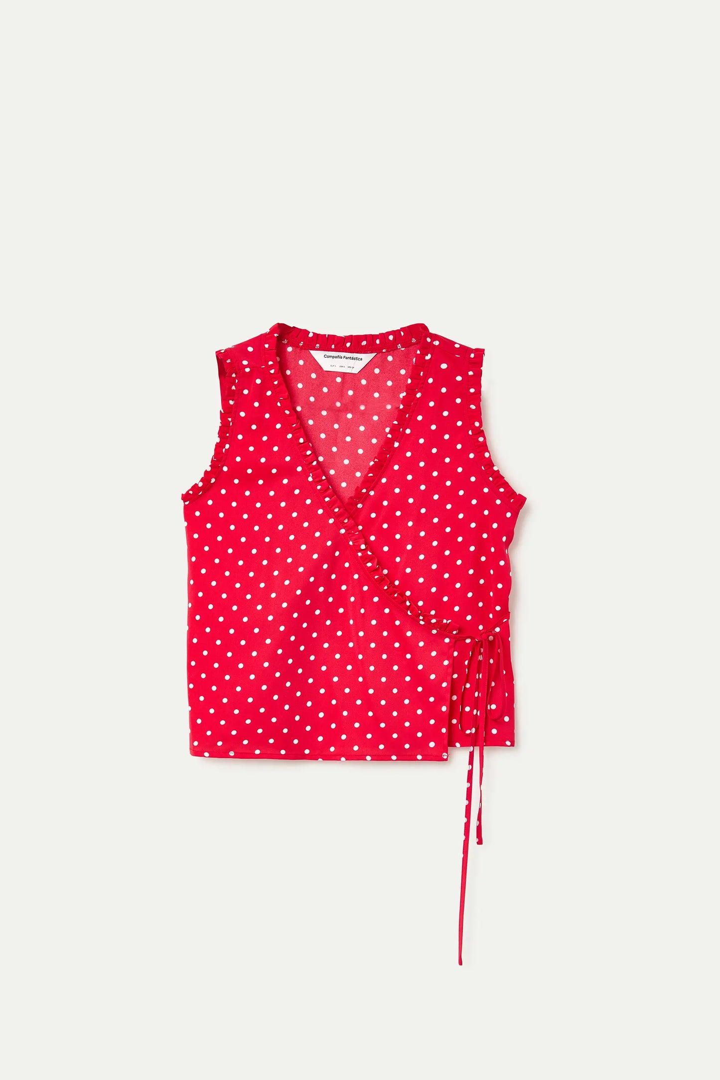 Top con stampa a mini pois rossi