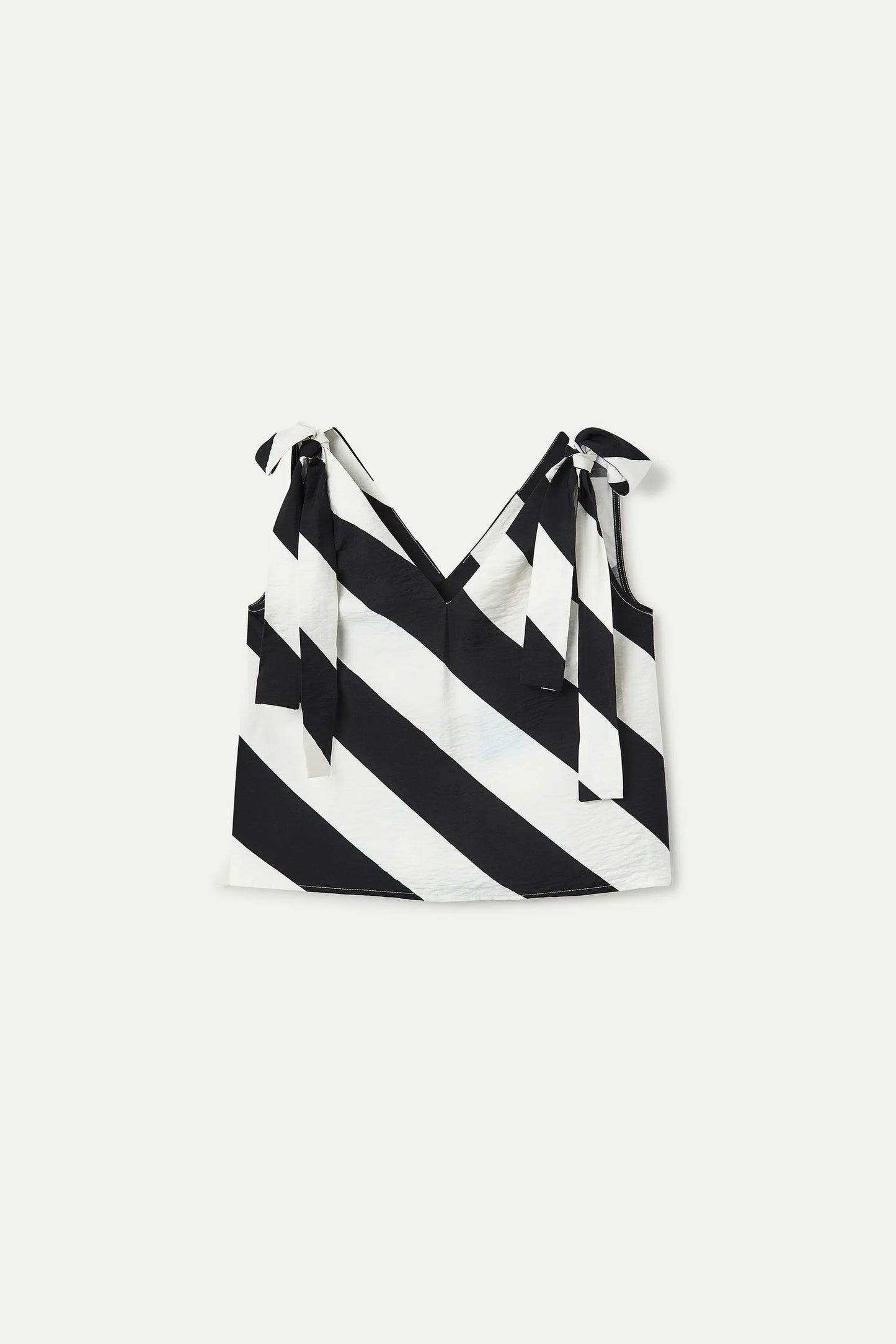 Top con stampa a righe diagonali in bianco e nero