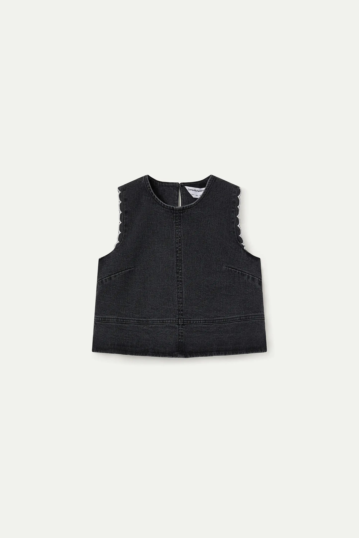 Top in denim nero con dettagli ondulati