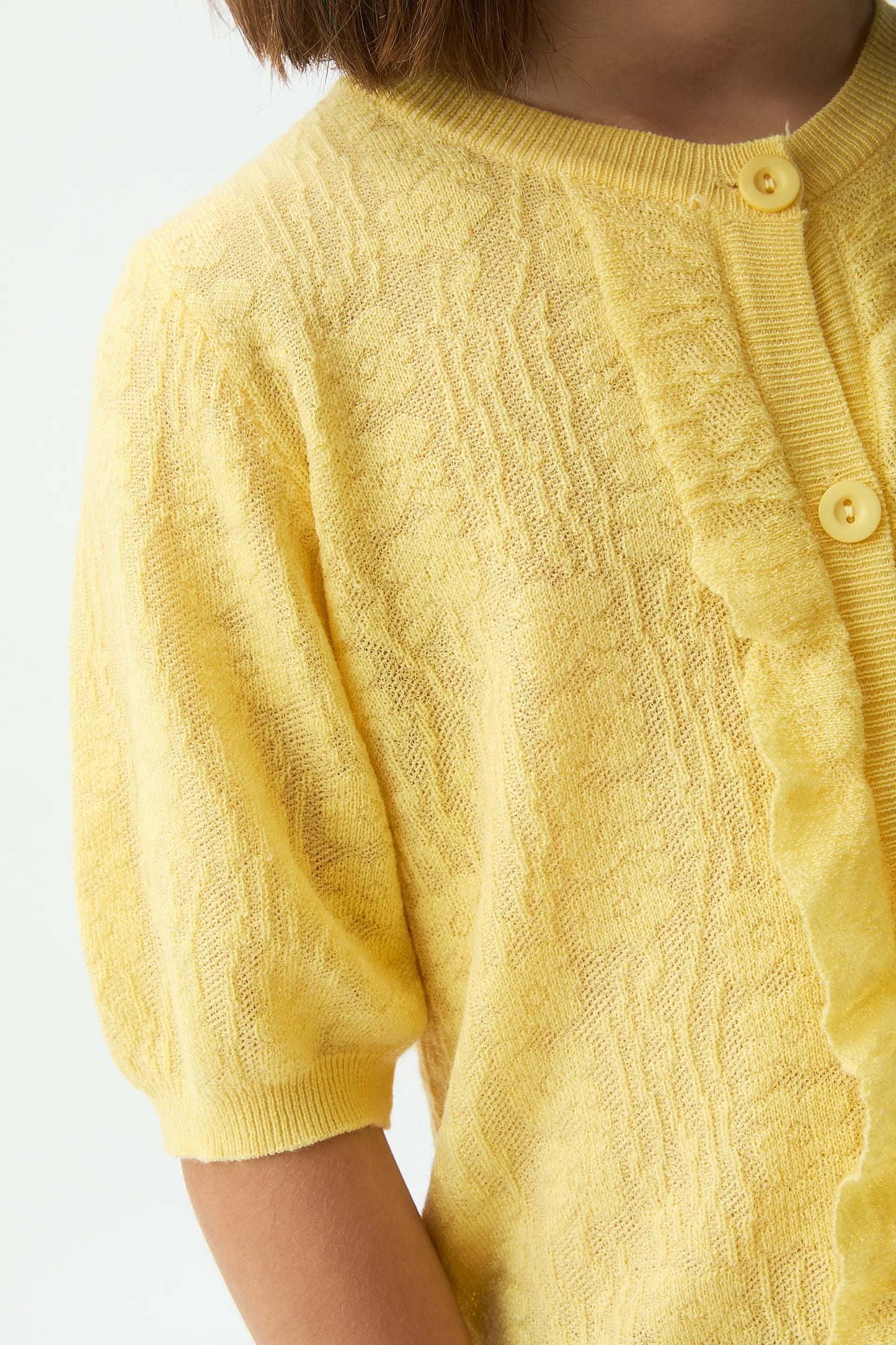 Cardigan giallo in maglia da bambina